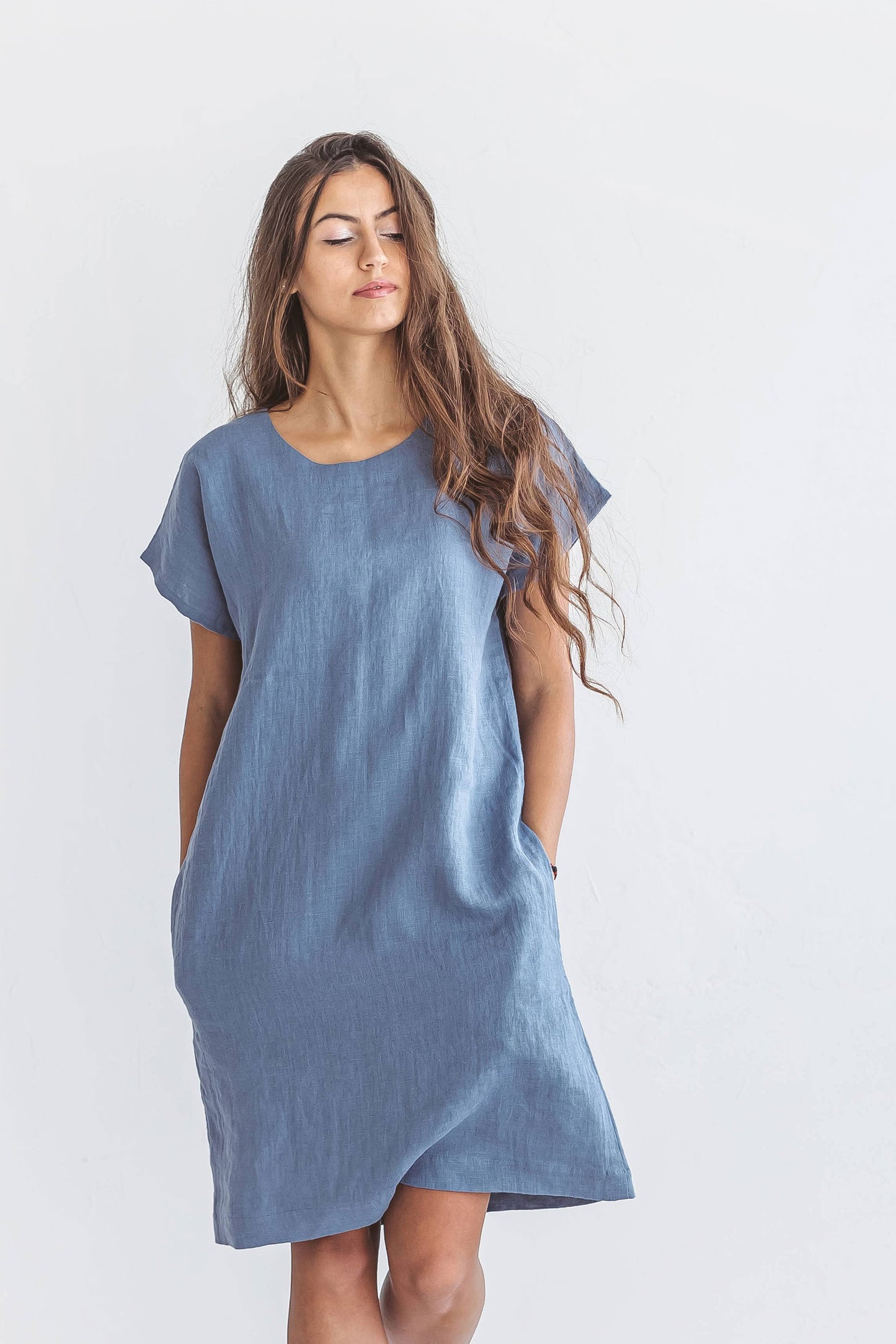 Close up studio view of woman wearing Diane linen dress, handmade linen dress slow fashion