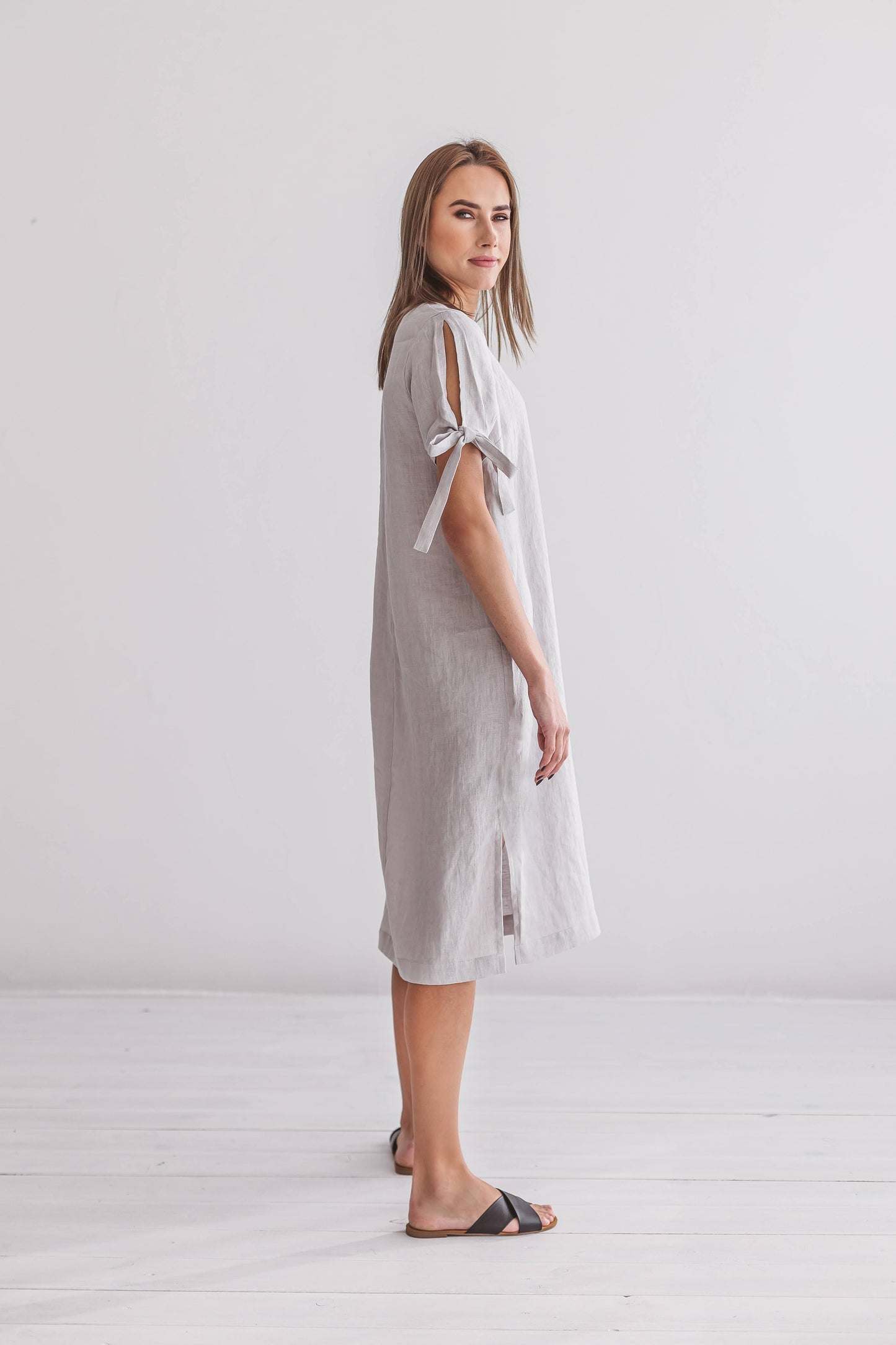 Grey linen midi dress side view showing minimalist silhouette, handmade linen dress slow fashion
