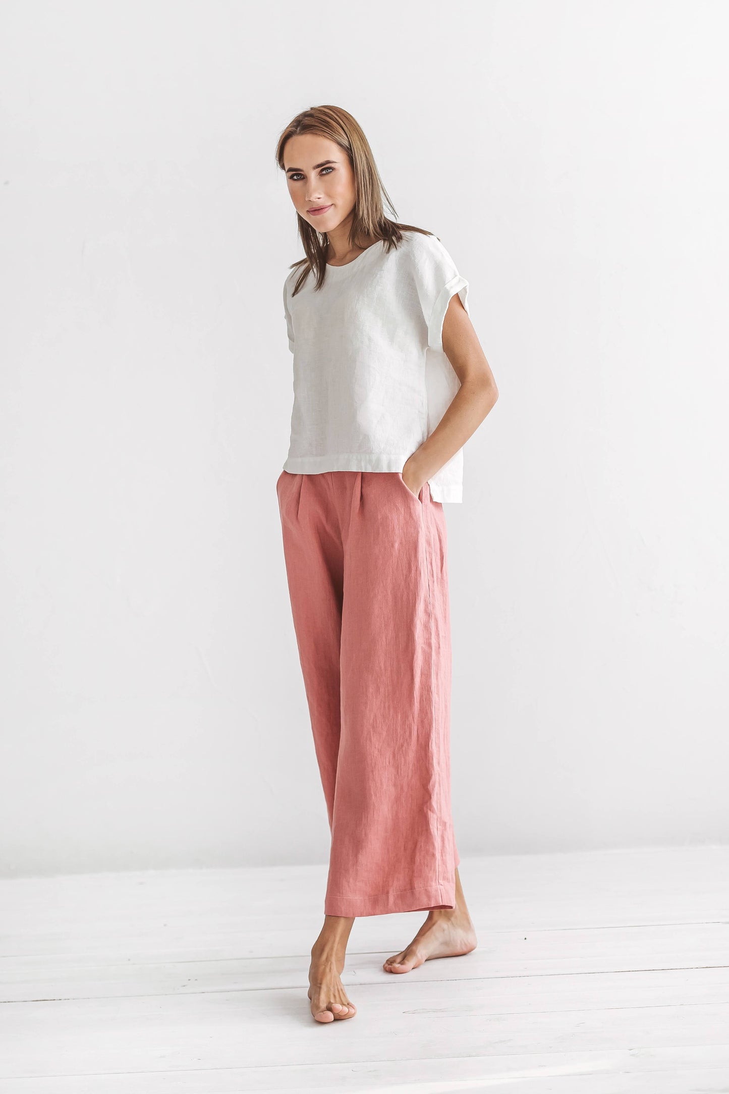 Salmon linen pants side profile emphasizing relaxed fit and straight leg line, handmade linen pants slow fashion