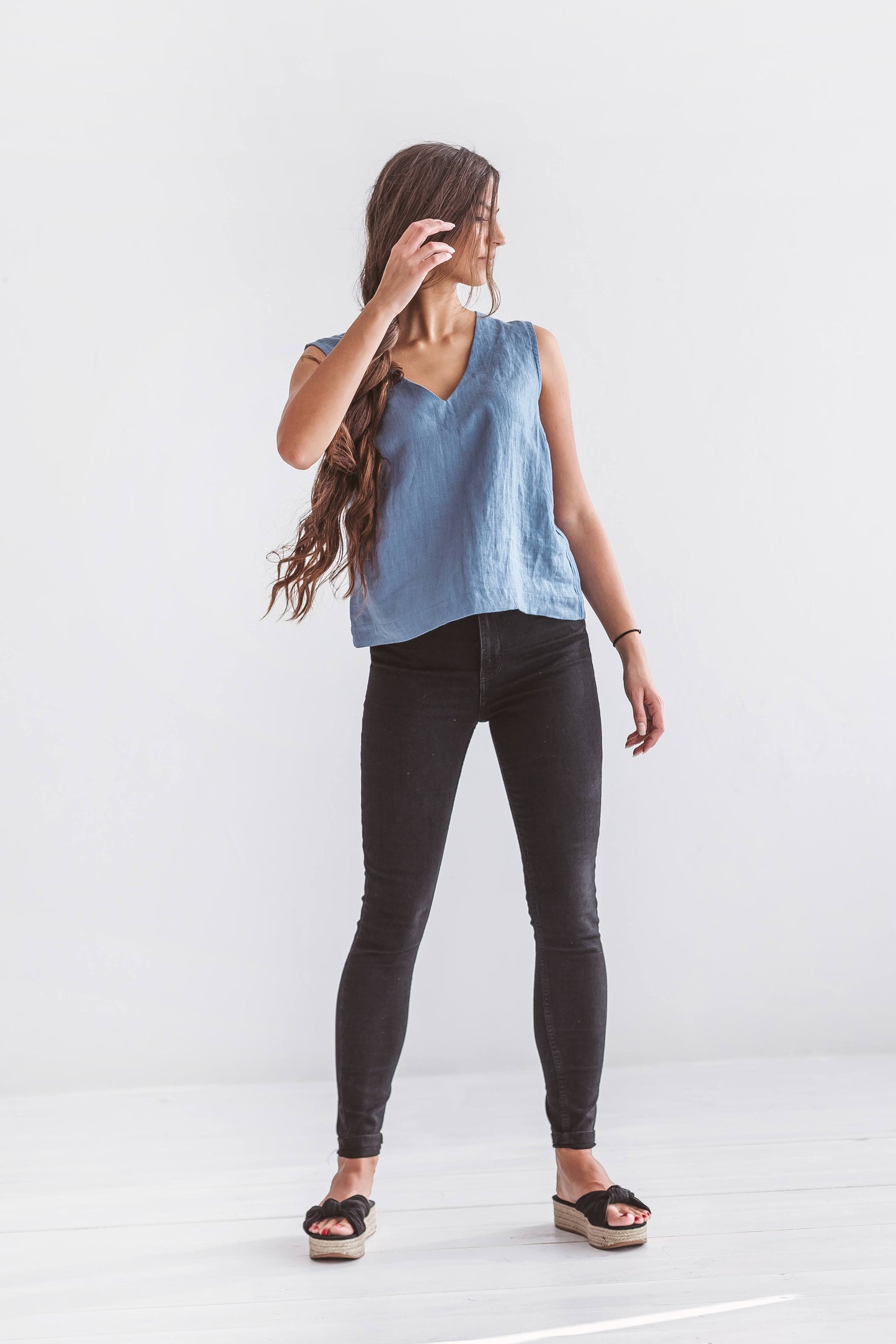 Back profile of women’s linen top with clean lines and soft drape, sustainable natural fiber clothing