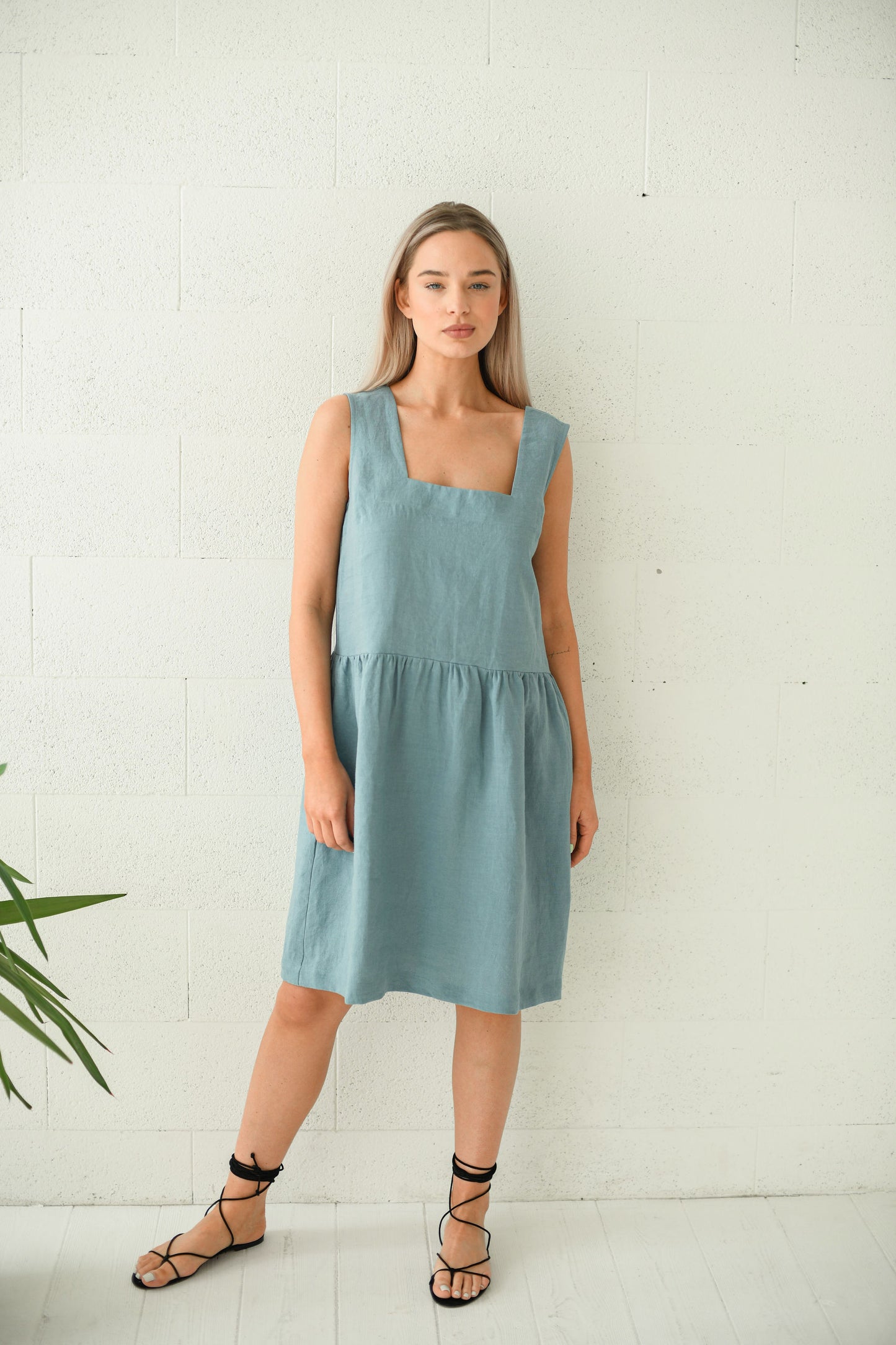 Dusty turquoise linen dress front view showing sleeveless minimalist design, handmade linen dress slow fashion