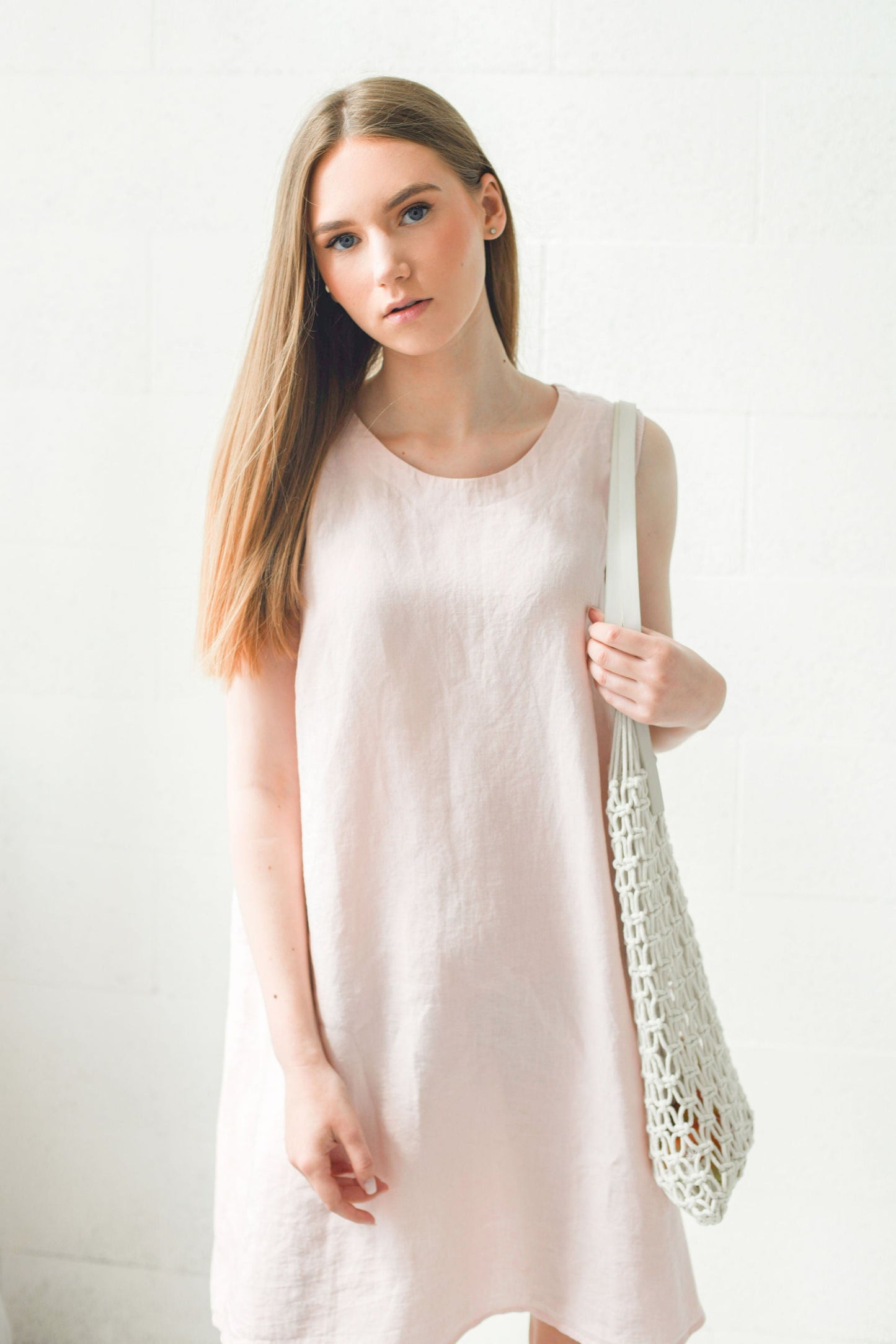 Dusty rose linen dress walking pose showing natural flow and a-line cut, handmade linen dress slow fashion