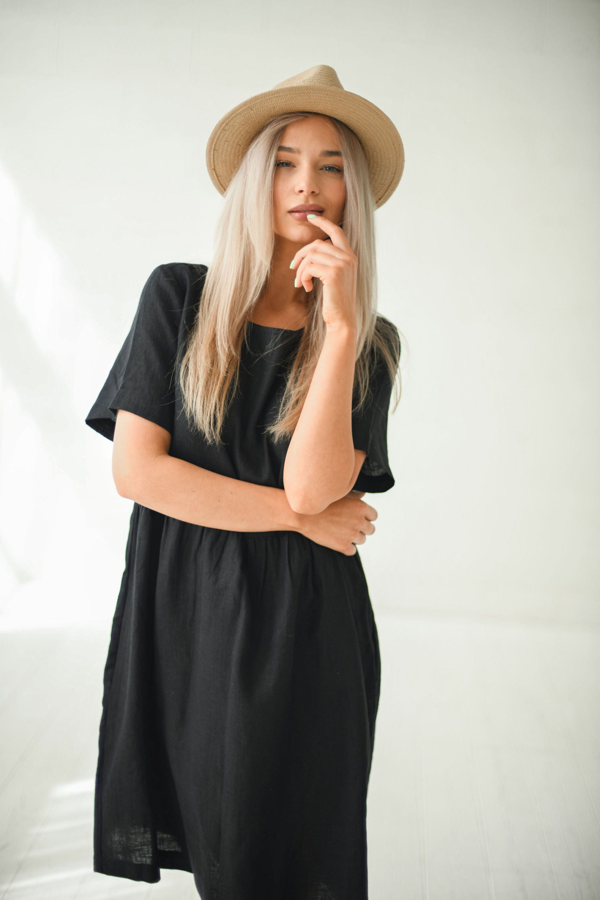 Alba black oversized linen dress closeup with hat smile handmade linen dress slow fashion