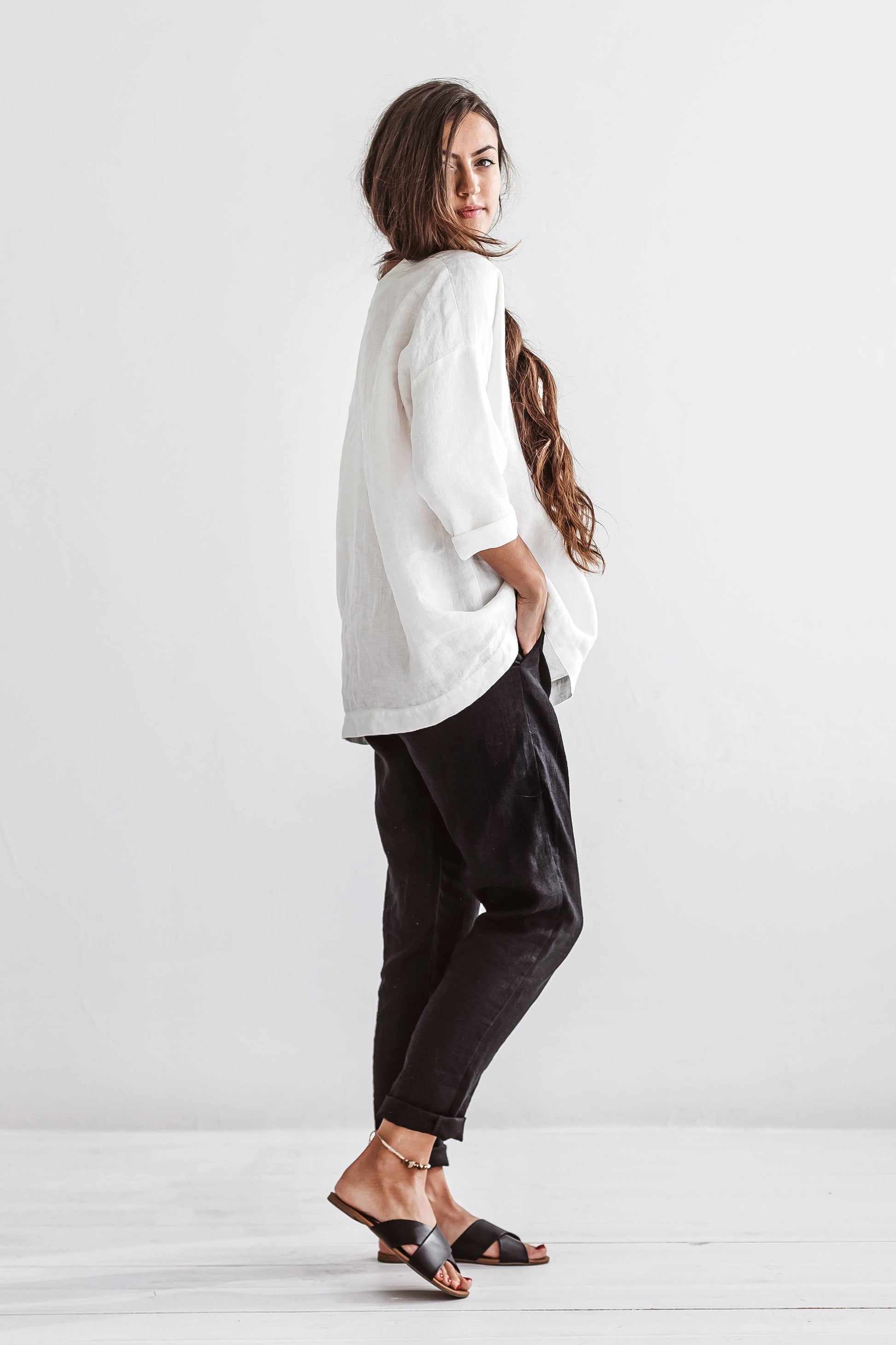 Camilla linen top front sitting pose minimalist style outfit