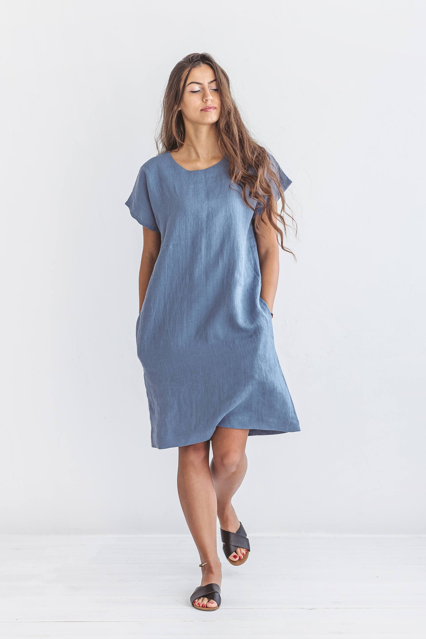Walking pose of woman in Diane linen dress, handmade linen dress slow fashion