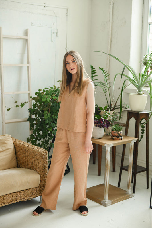 Caramel brown linen pants full-body front view in minimal studio, handmade linen pants slow fashion