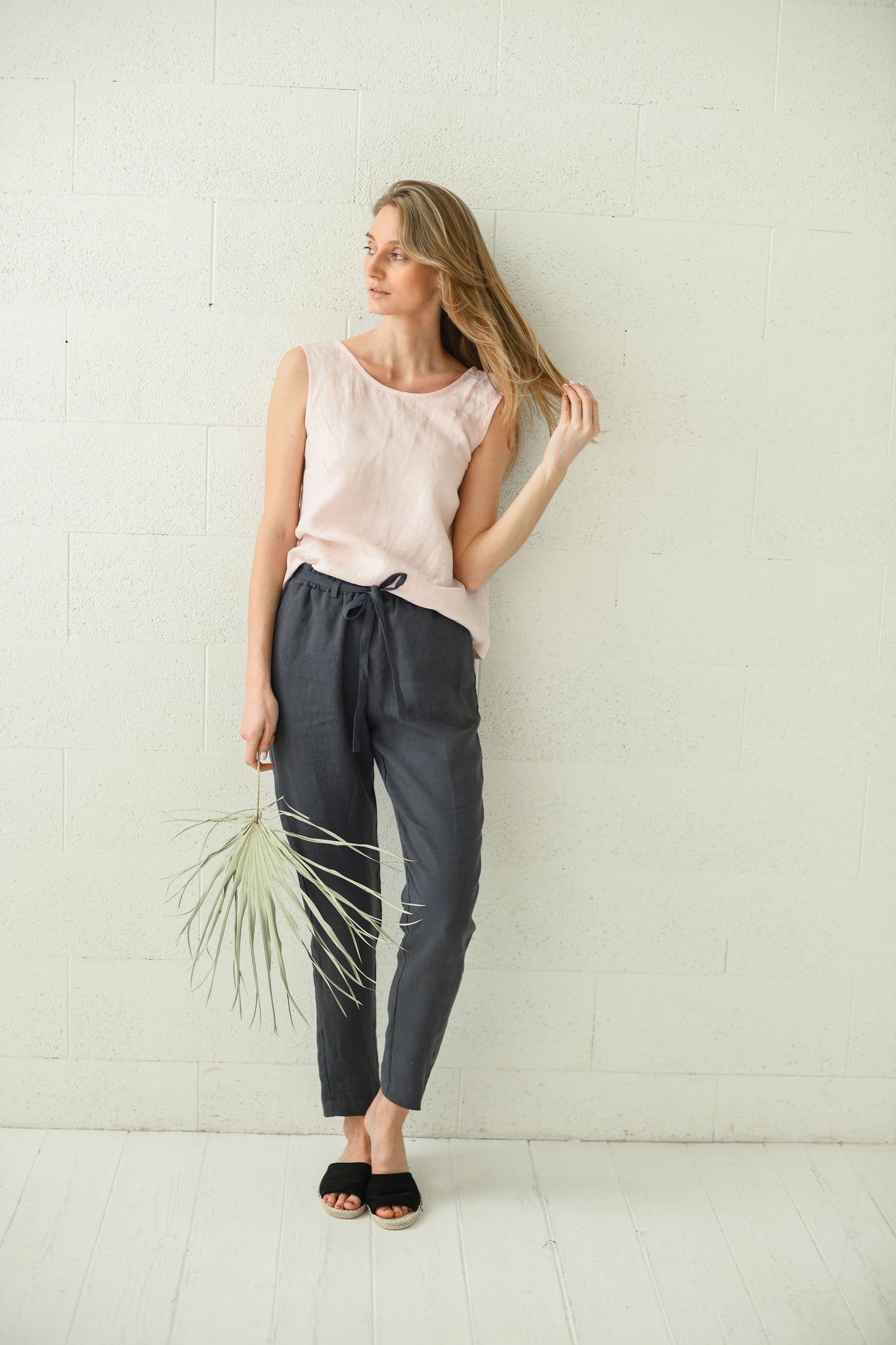 Black linen pants front full-body view with natural posture, handmade linen pants slow fashion