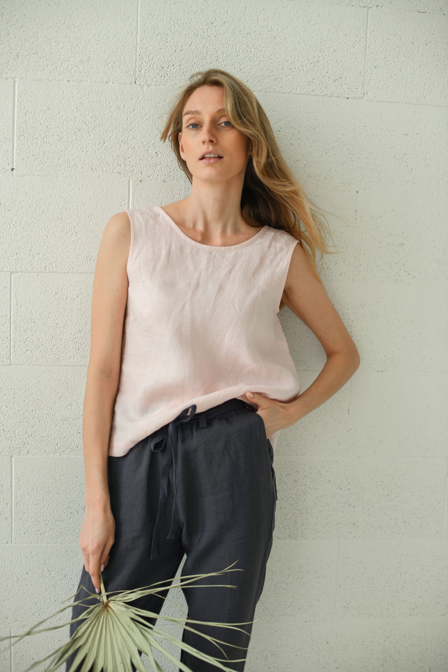 Black linen pants close-up waist detail showing soft waistband, handmade linen pants slow fashion