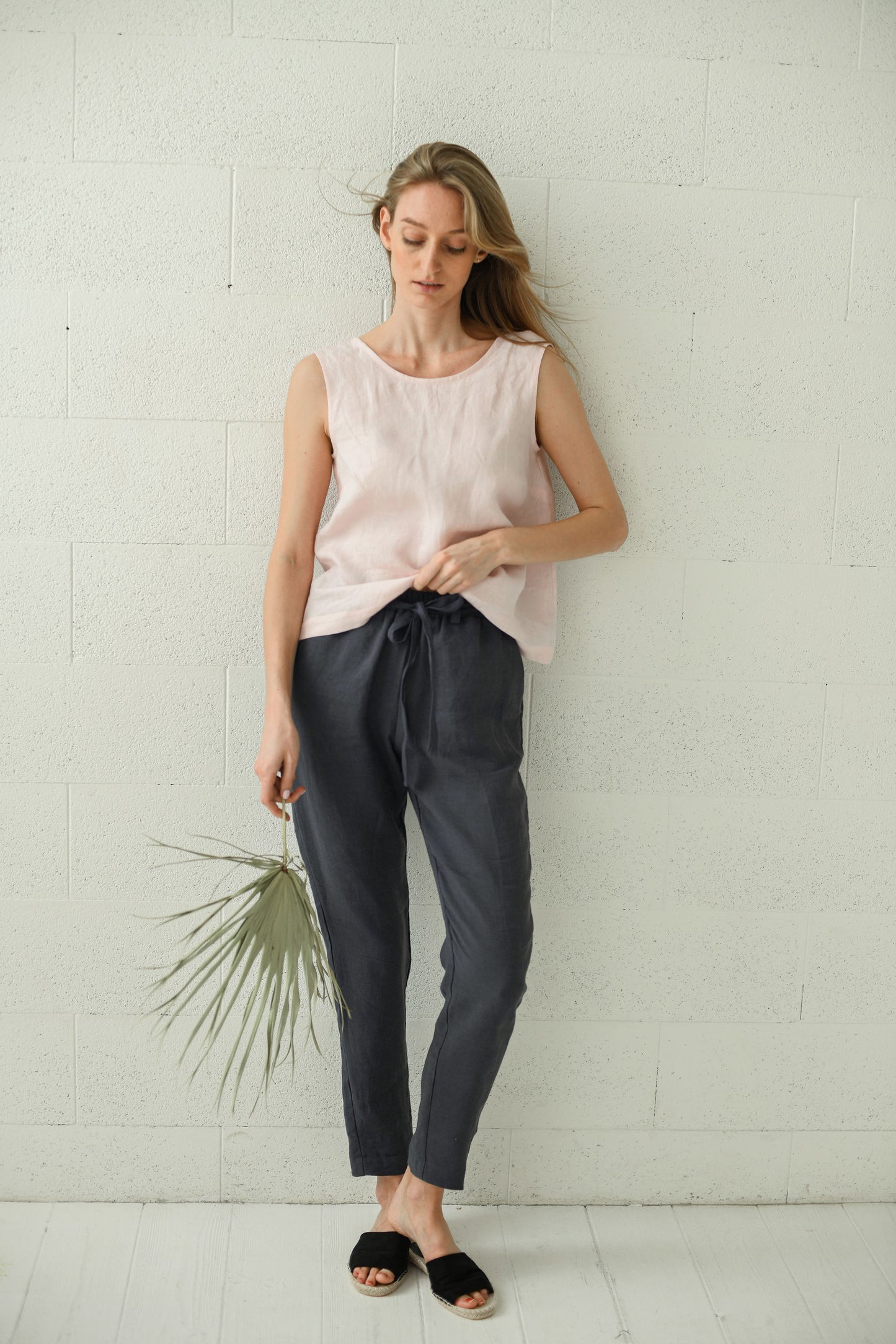 Black linen pants front full-body view looking down showing straight-leg cut, handmade linen pants slow fashion