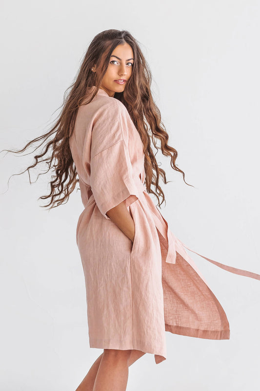 Pastel pink linen robe side view with natural drape and kimono silhouette, handmade linen robe slow fashion