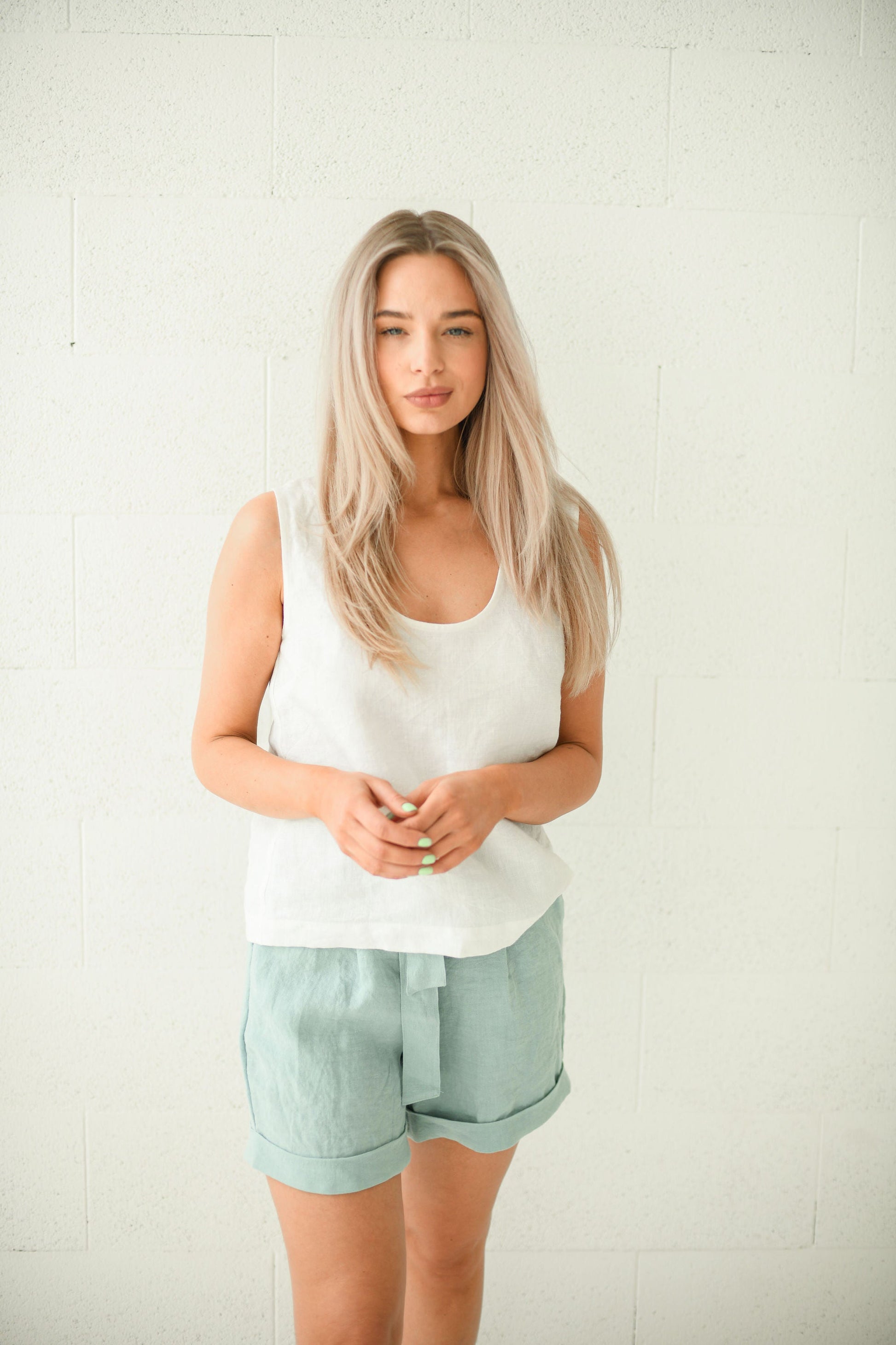 Abigail white linen sleeveless top with linen shorts close up front view