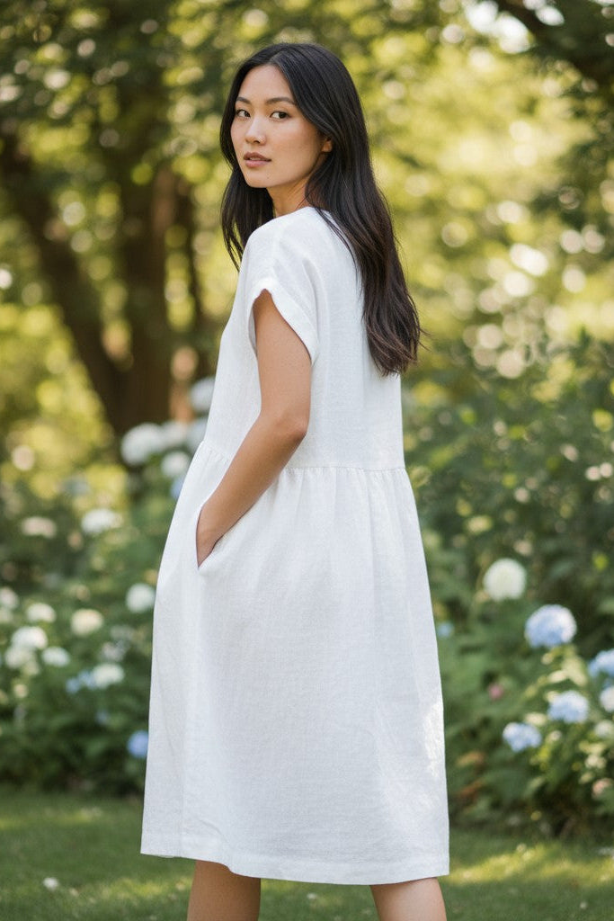 Alice linen dress – wide skirt detail, natural drape, side view
