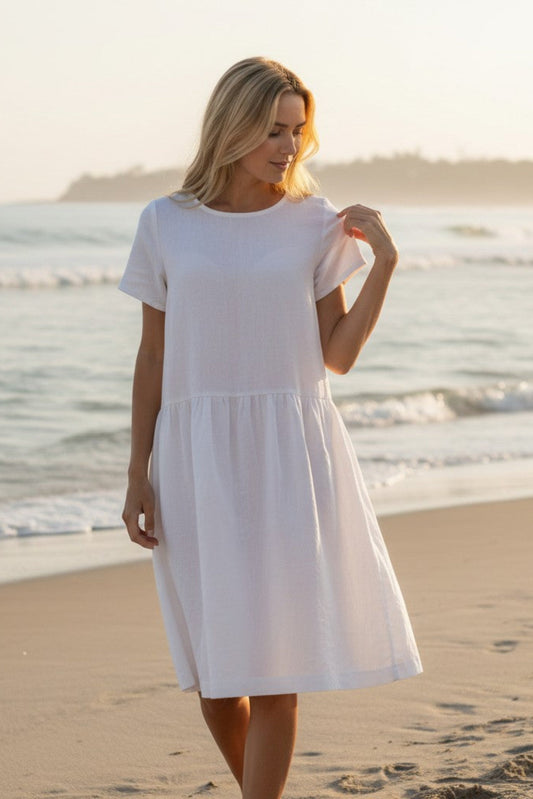 Amelia linen dress – white, full front view with ruffled skirt
