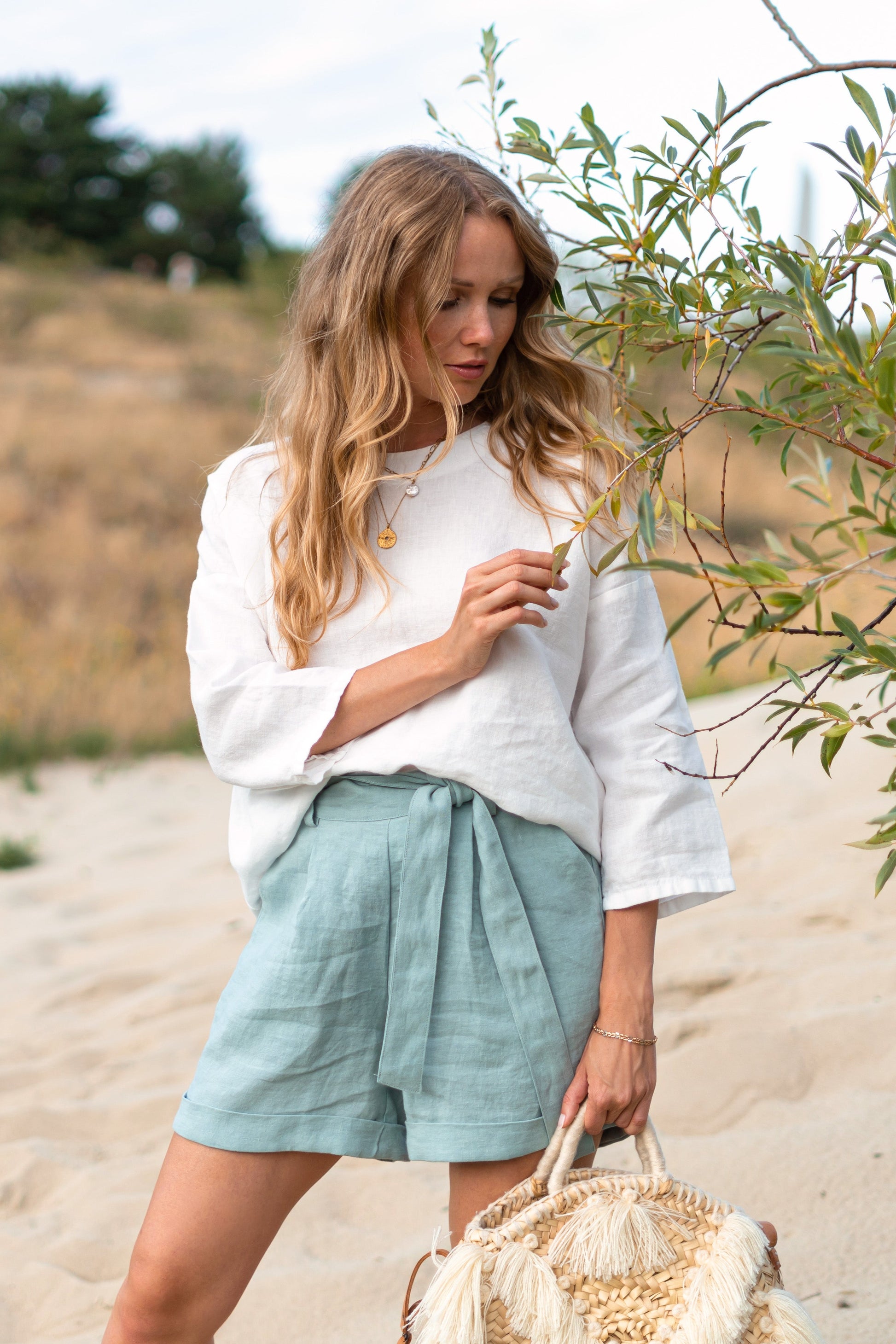 Camilla linen top side view showing relaxed fit and minimalist drape handmade linen slow fashion