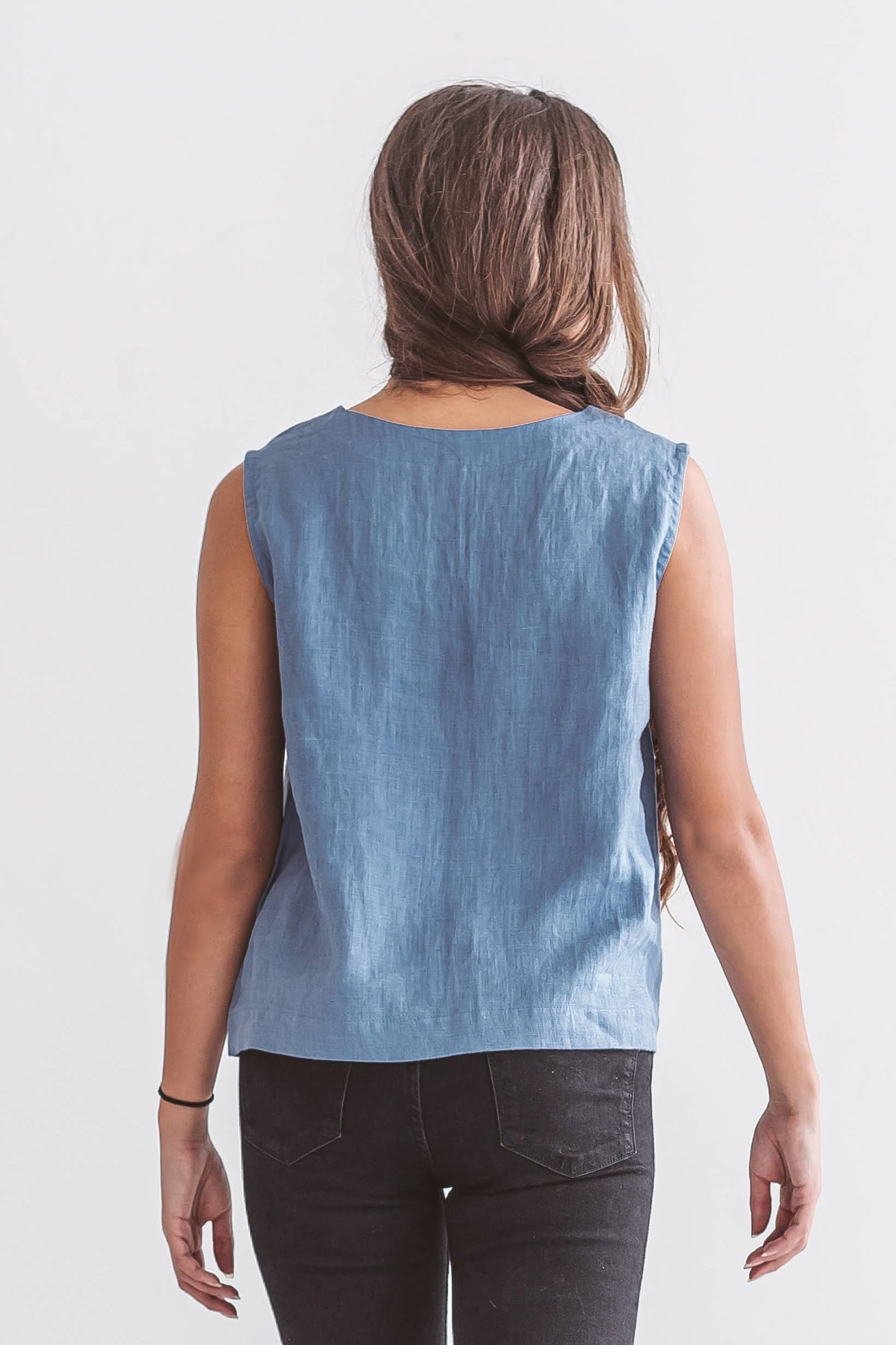 Back view of sleeveless linen top with relaxed drape, ethical women’s clothing made from natural fibers.