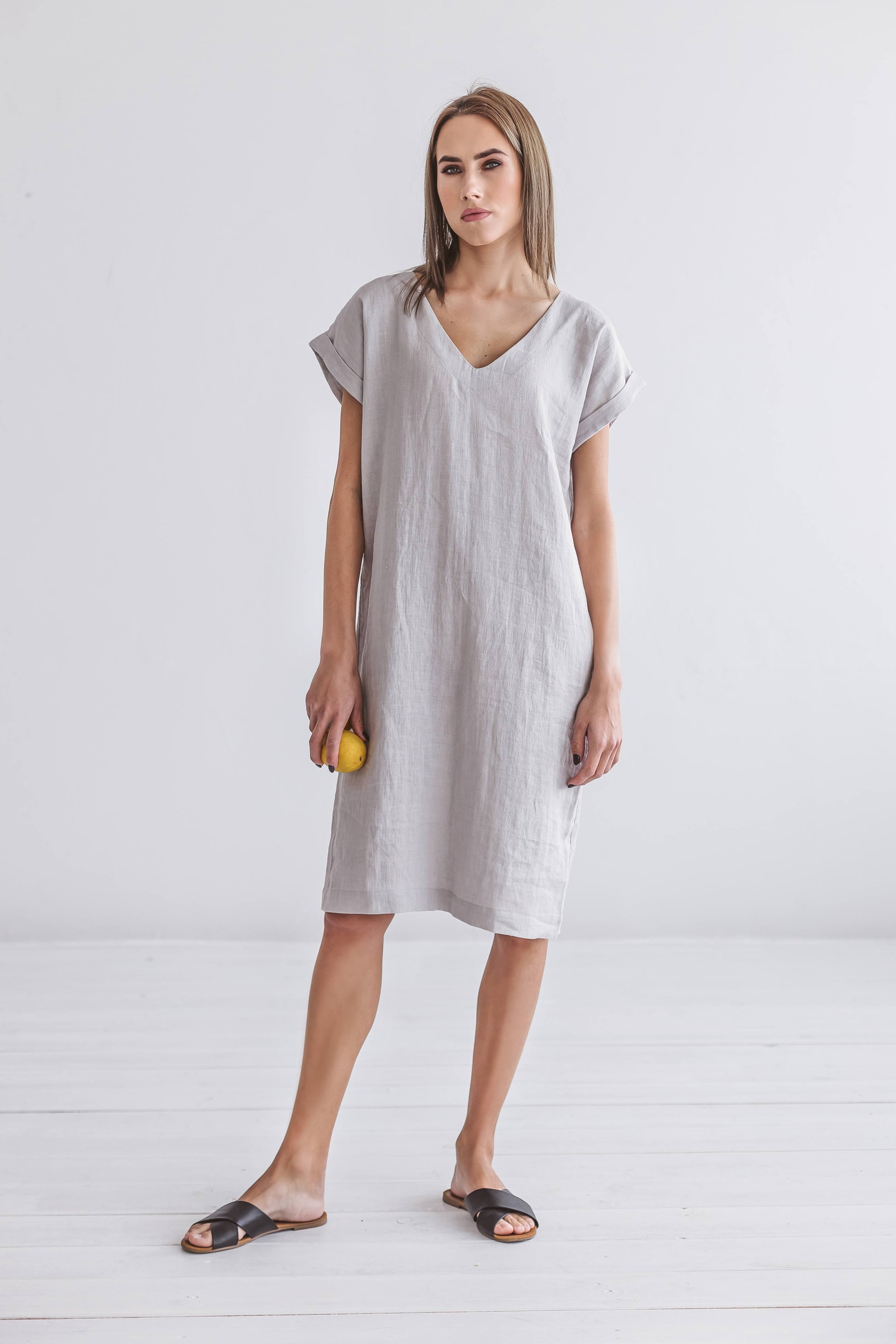 Relaxed linen midi dress front standing view showing natural fabric flow