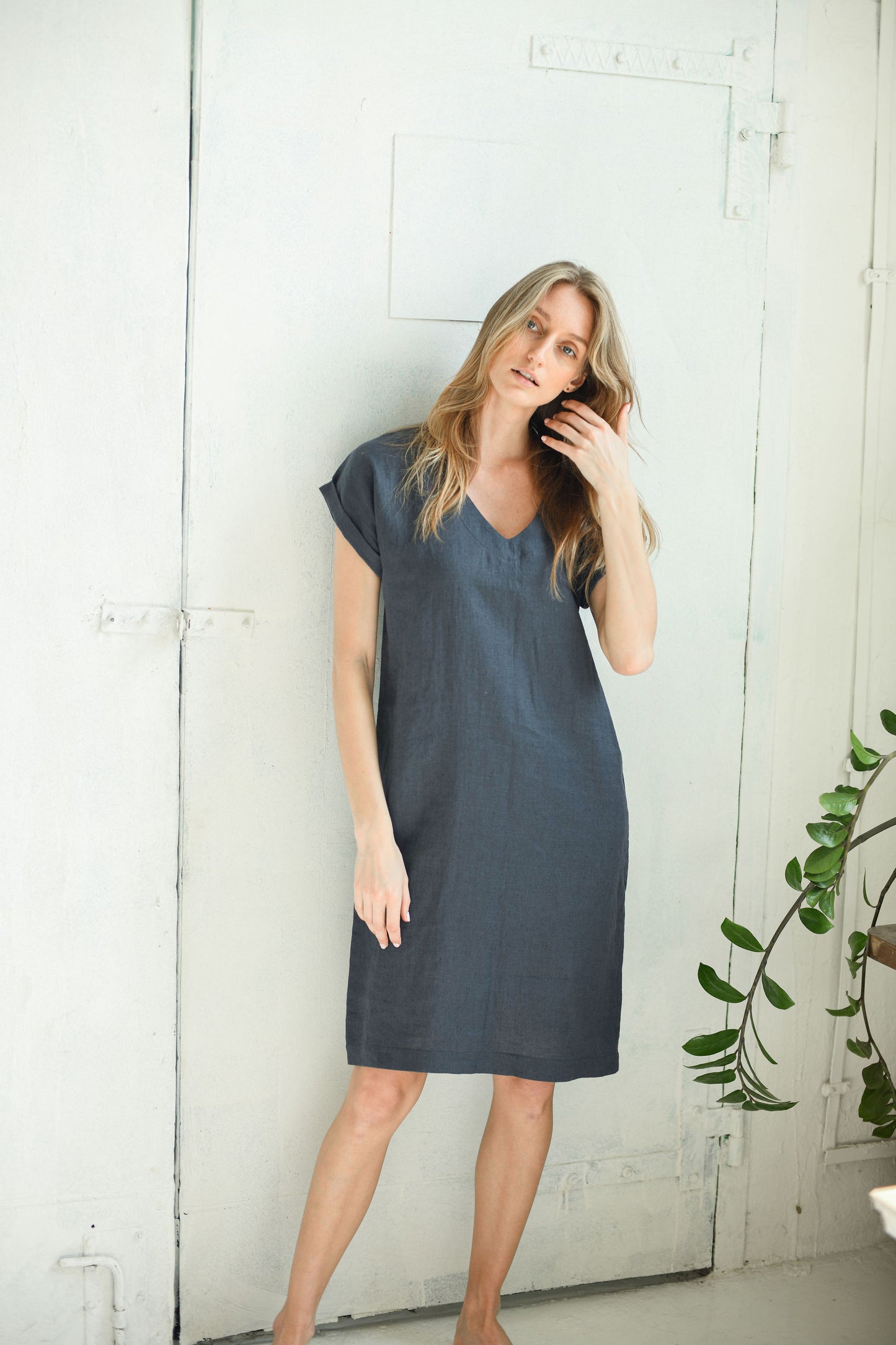 V-neck linen midi dress front pose with soft sleeves