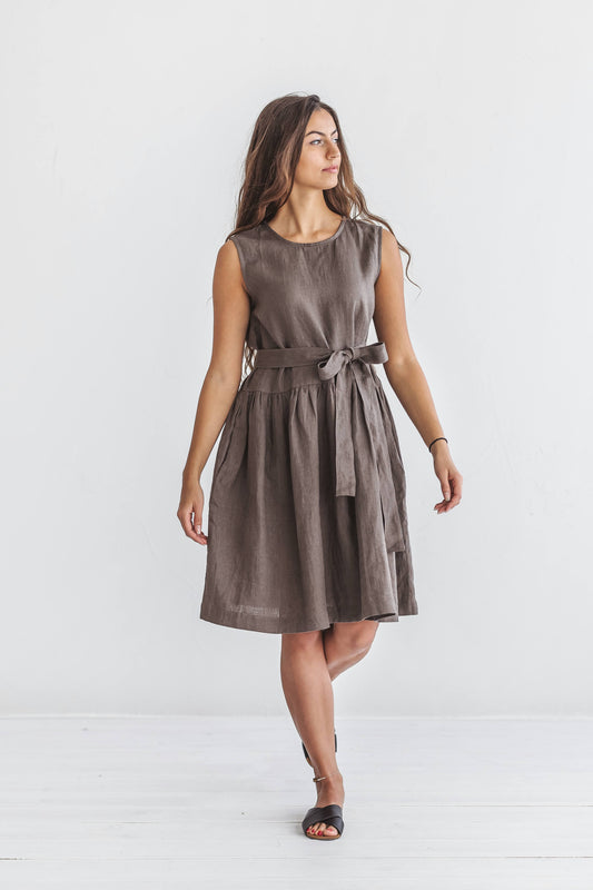 Model walking in the beige Kelly linen dress, skirt moving gently with natural motion