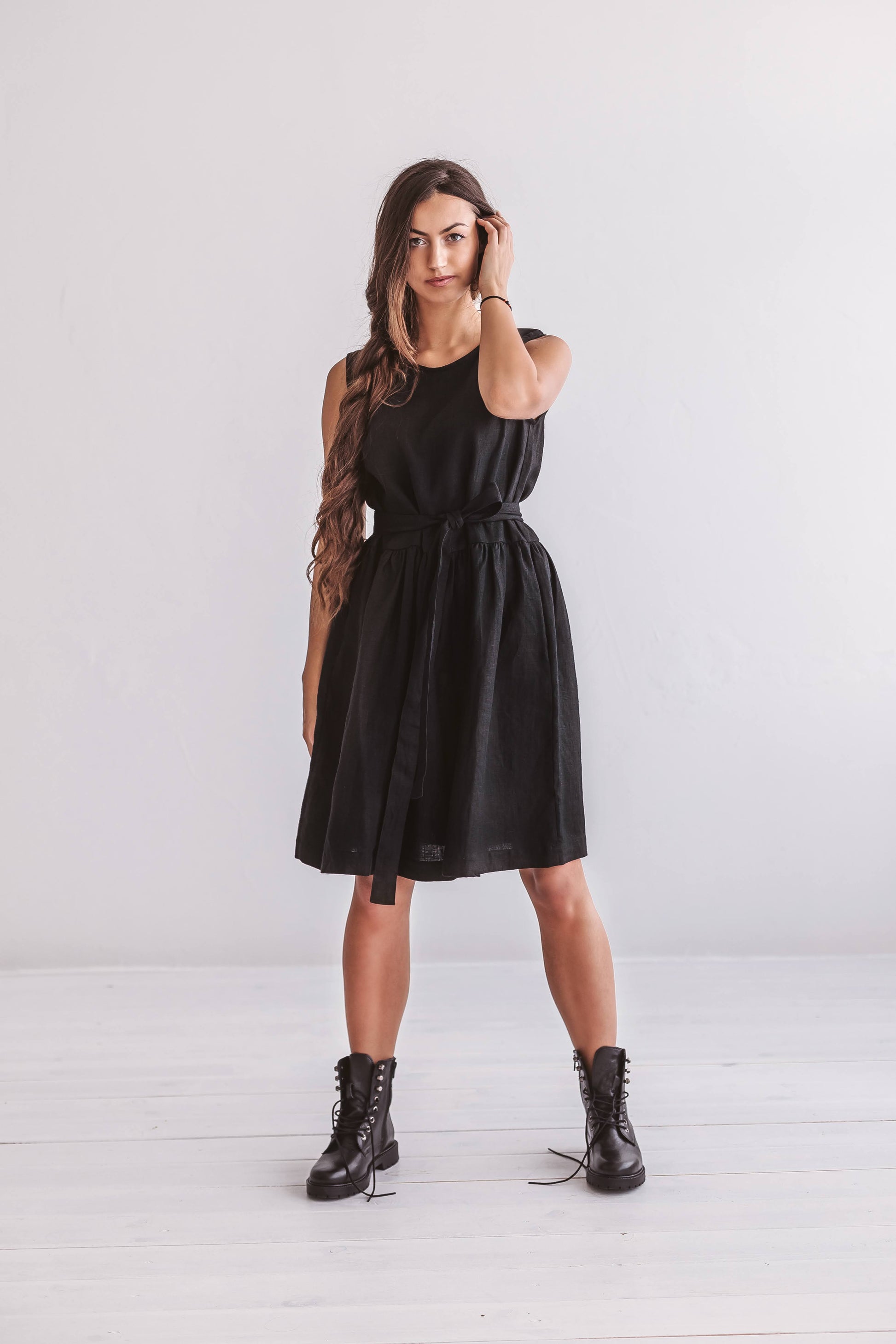 Minimalist studio shot of the Kelly linen dress with wide straps and free-flowing silhouette