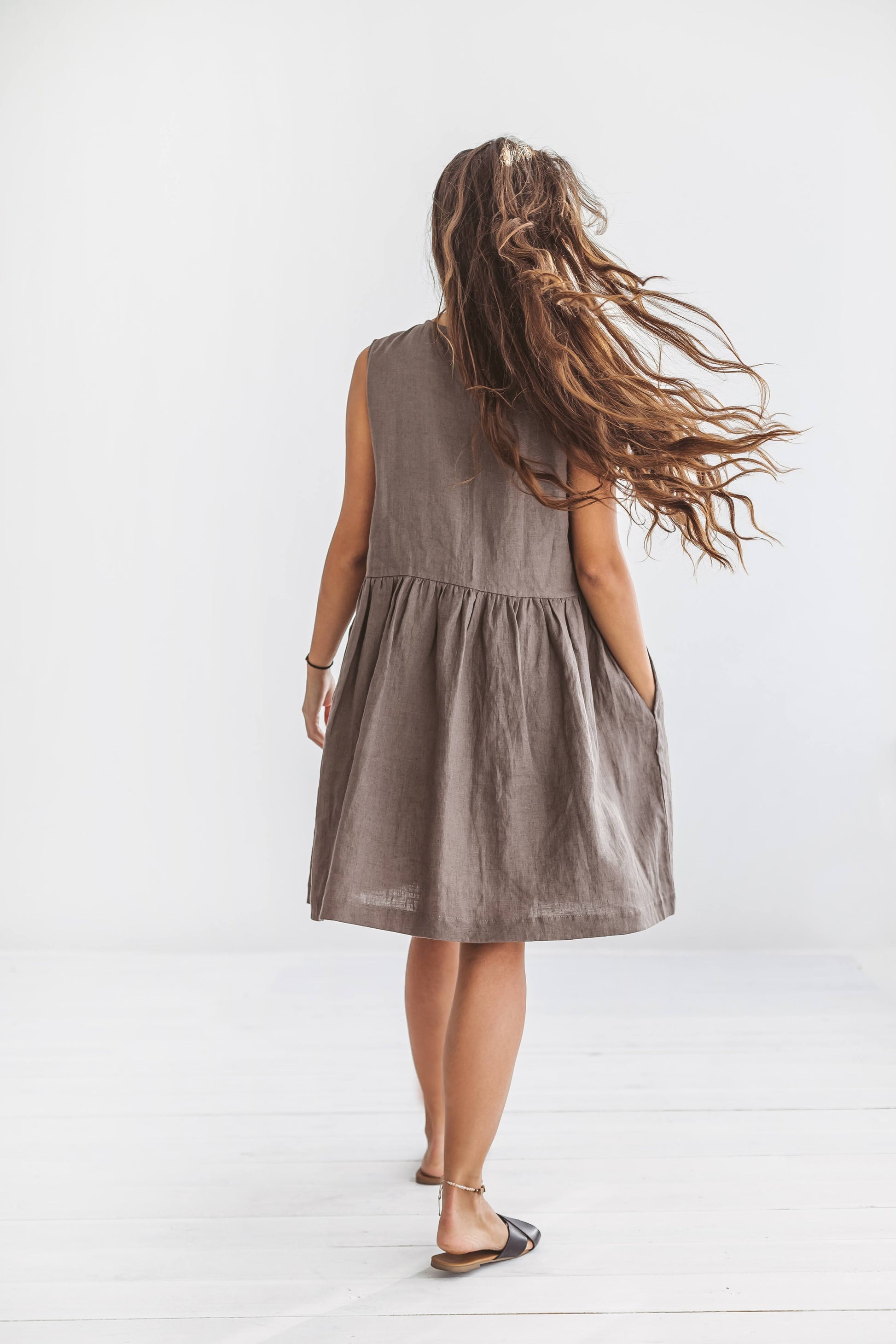 Full-body front view of the beige Kelly linen dress with soft A-line silhouette and wide straps