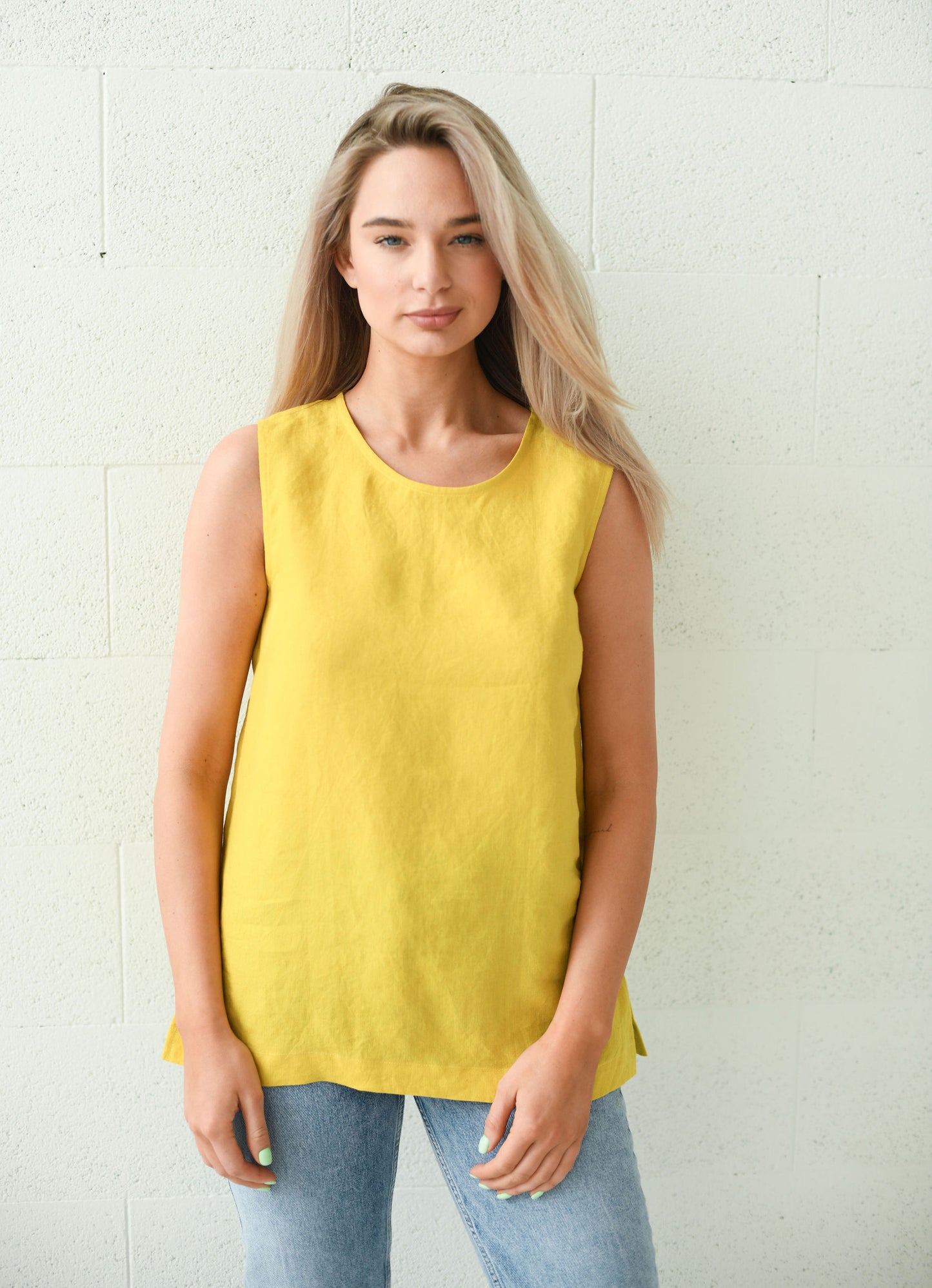 Front view of the Laura linen top with clean neckline and relaxed fit