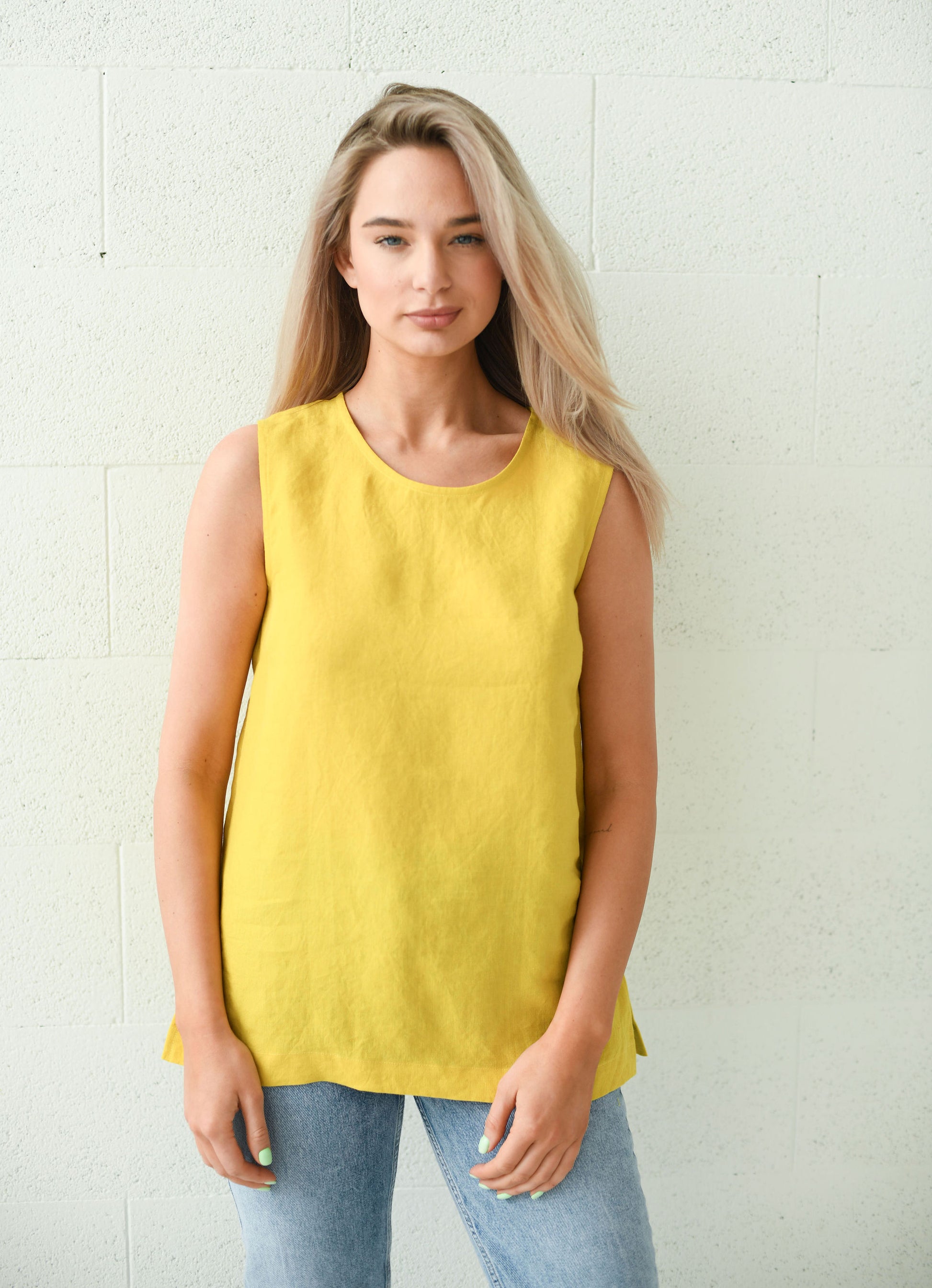 Front view of the Laura linen top with clean neckline and relaxed fit