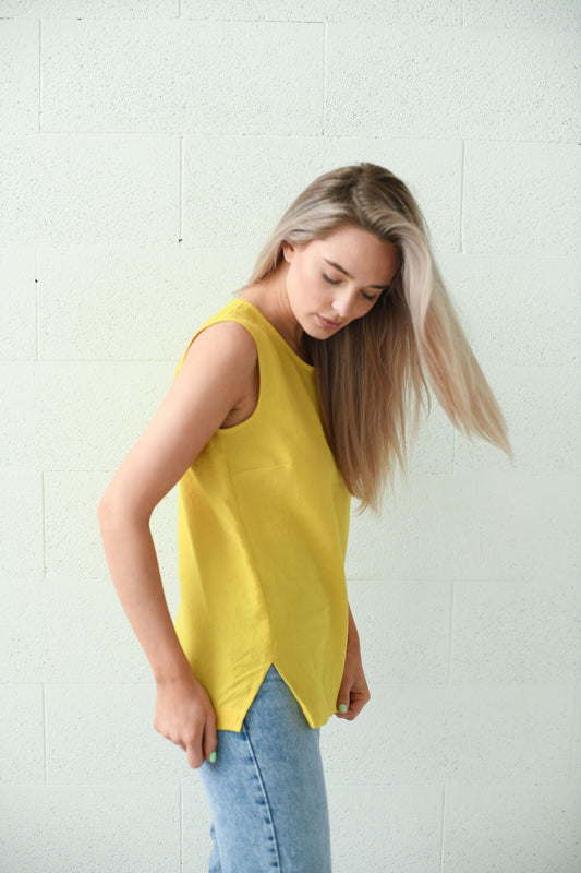 Laura linen top photographed in natural light showing soft linen texture and simple silhouette