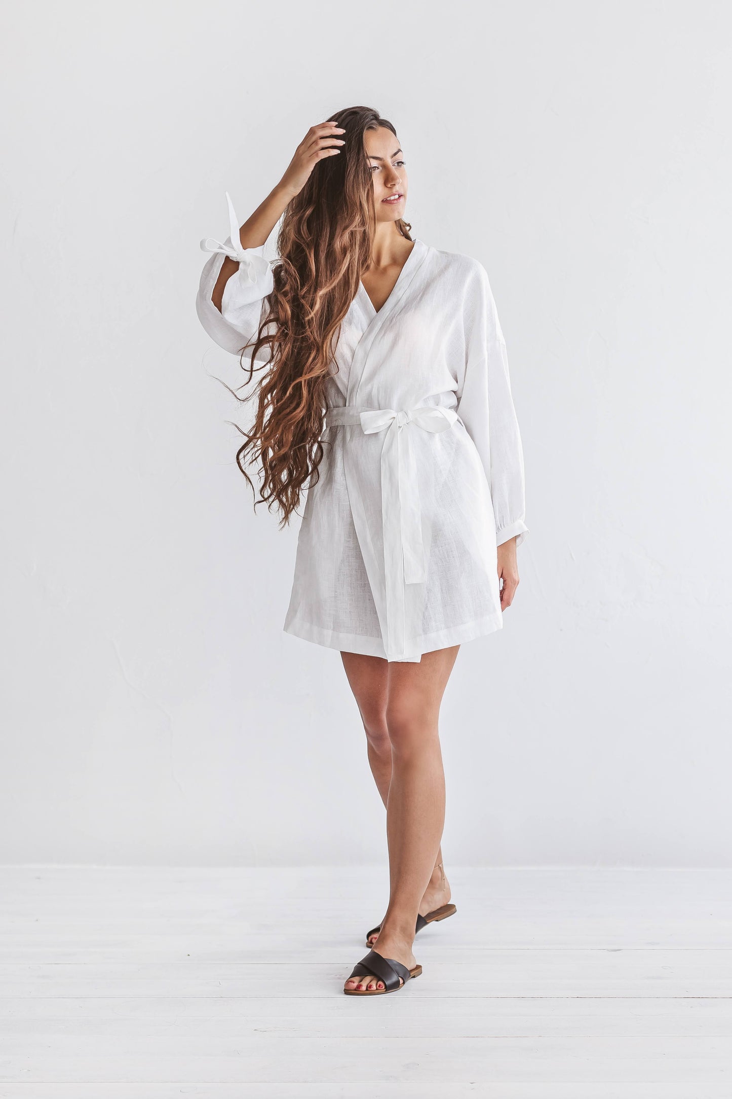 Back view of the Lauren linen robe showing relaxed fit and wrap silhouette