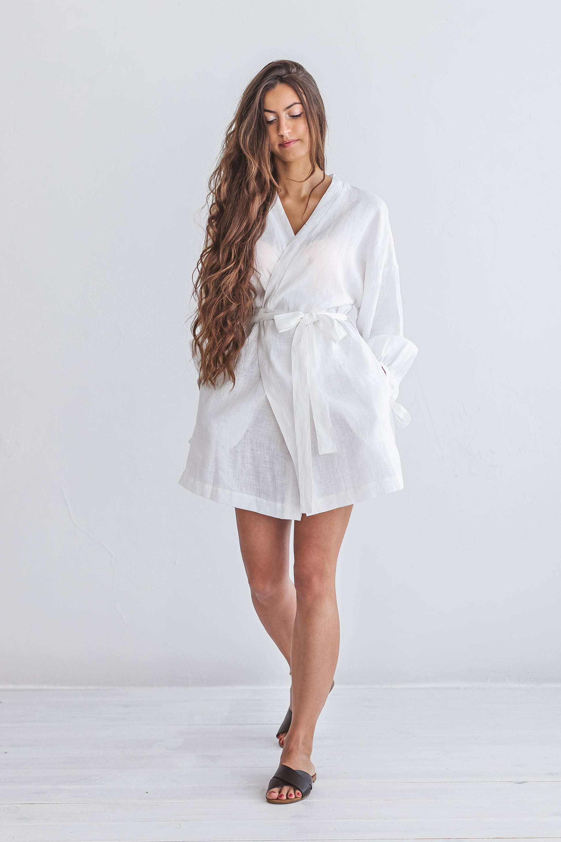 Front view of the Lauren linen robe in natural light with adjustable belt