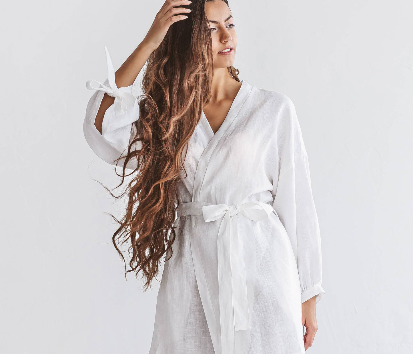 Close-up front view of the Lauren linen robe highlighting wrap front and waist belt
