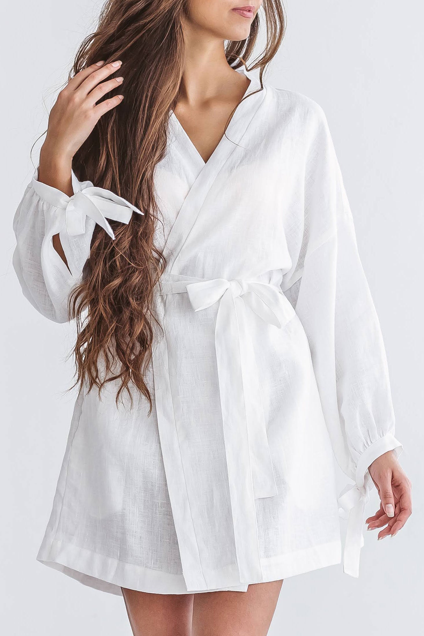 Side view of the Lauren linen robe showing wrap silhouette and belt tie