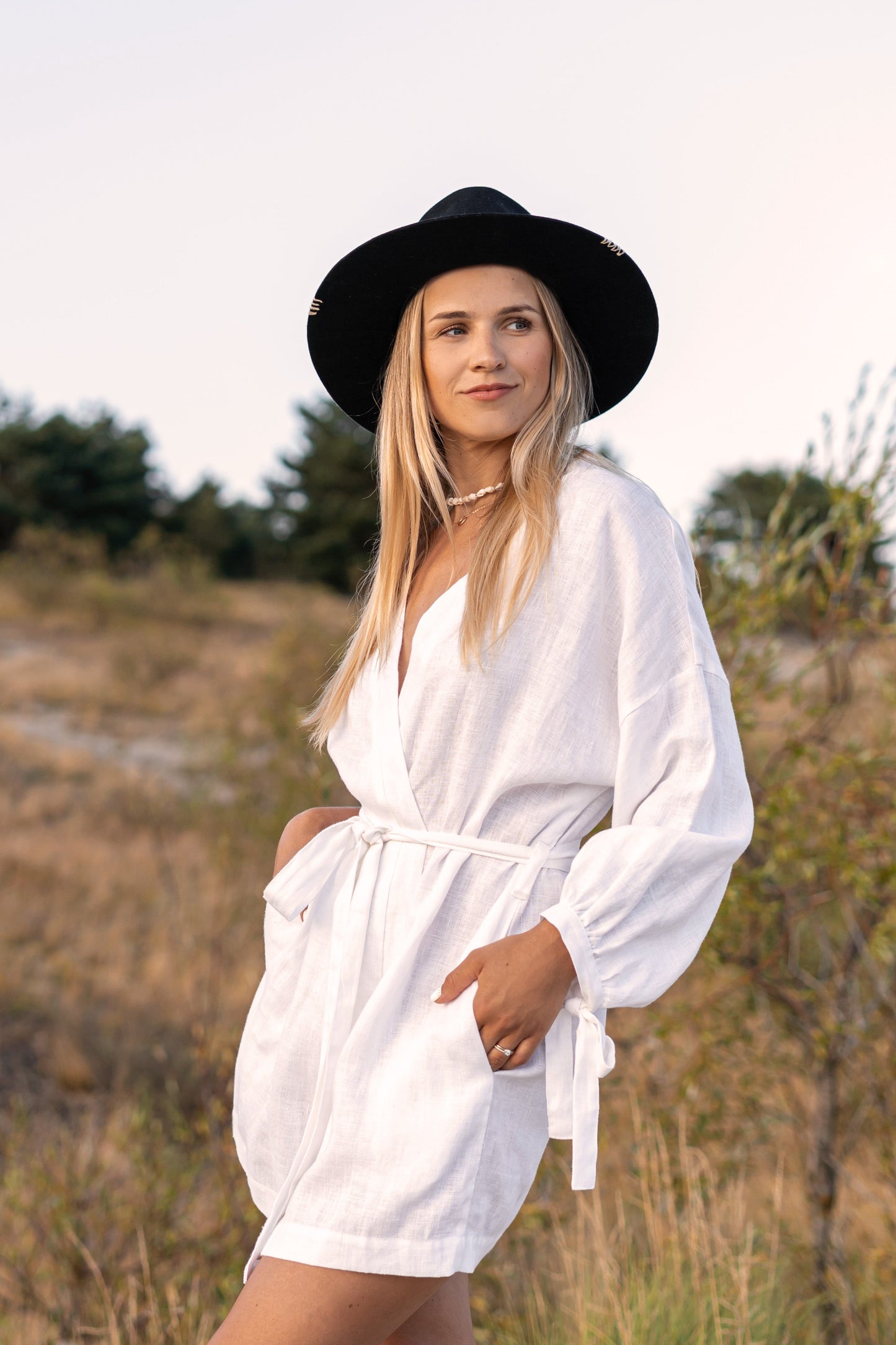 Front view of the Lauren linen robe photographed in soft natural light in an open field