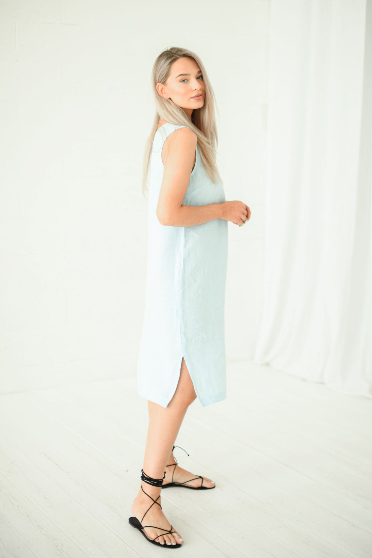 Full-body view of light blue linen midi dress with straight cut, handmade linen dress slow fashion