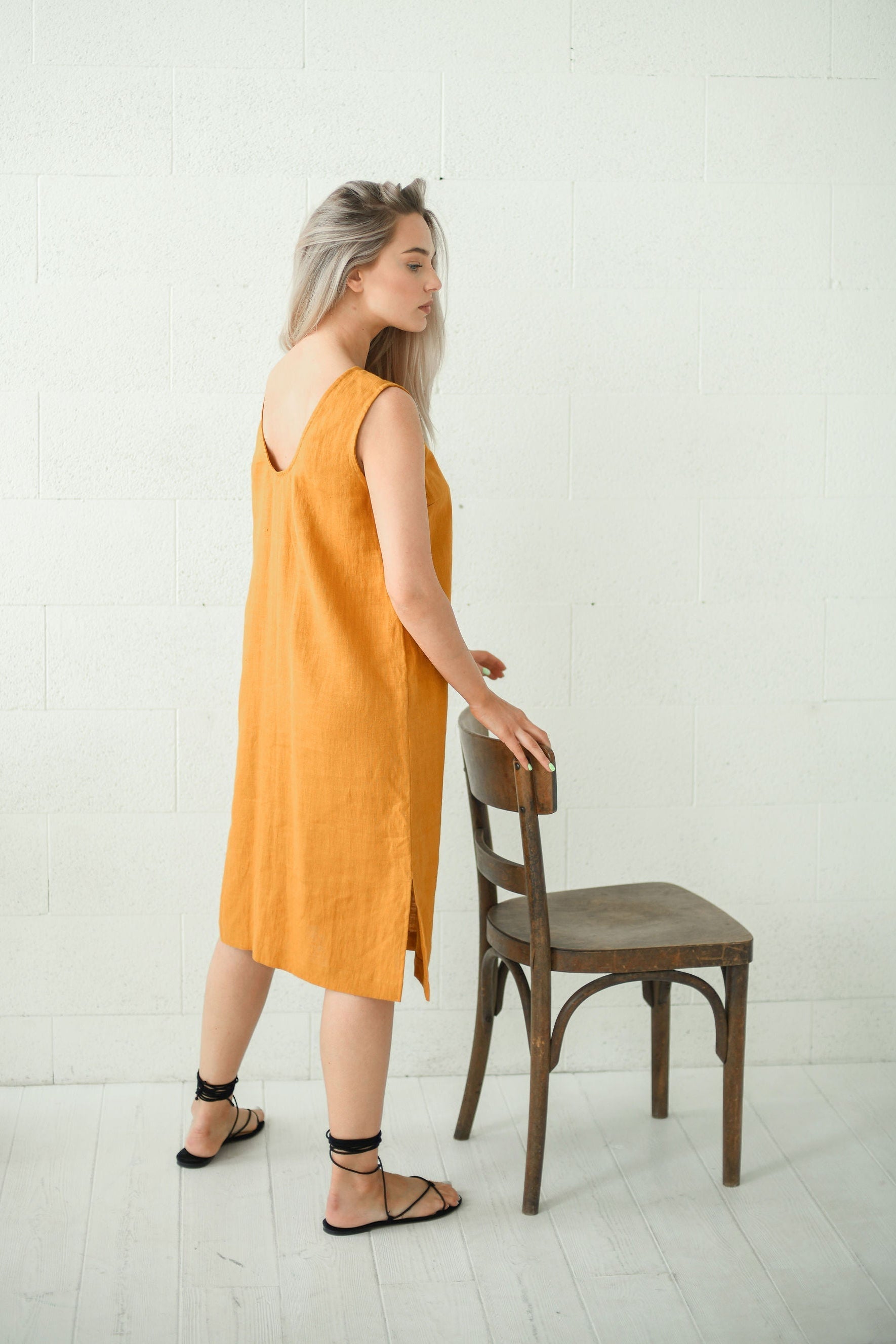 AVERY mustard linen midi dress side left with chair handmade linen dress slow fashion