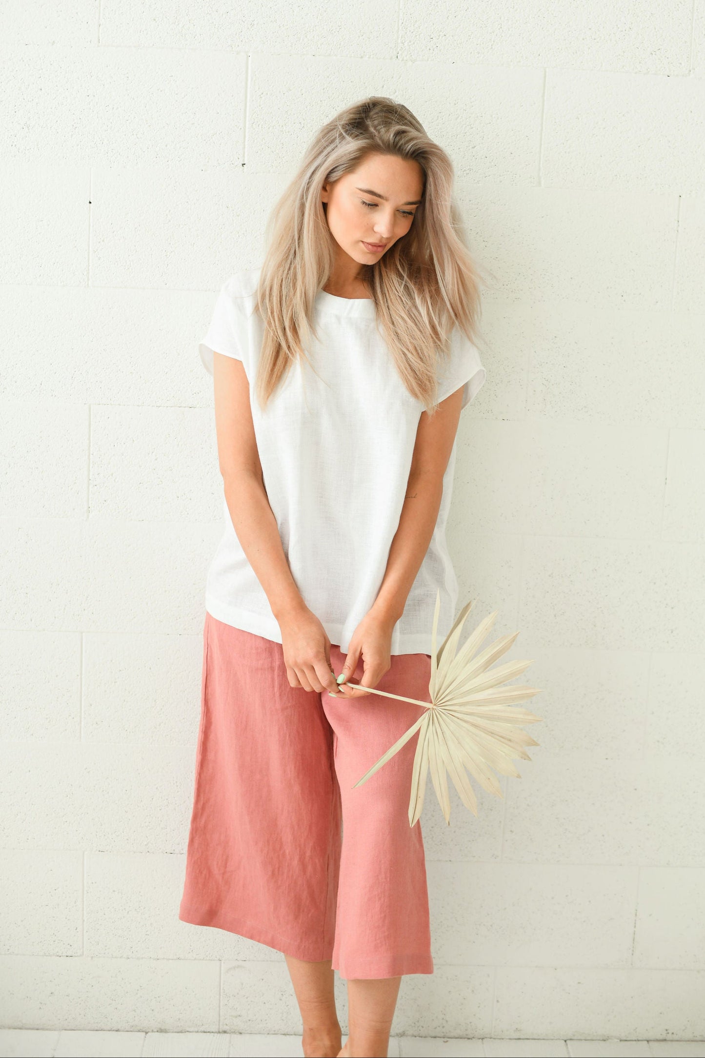 White linen top soft relaxed standing pose minimalist studio, handmade linen top slow fashion
