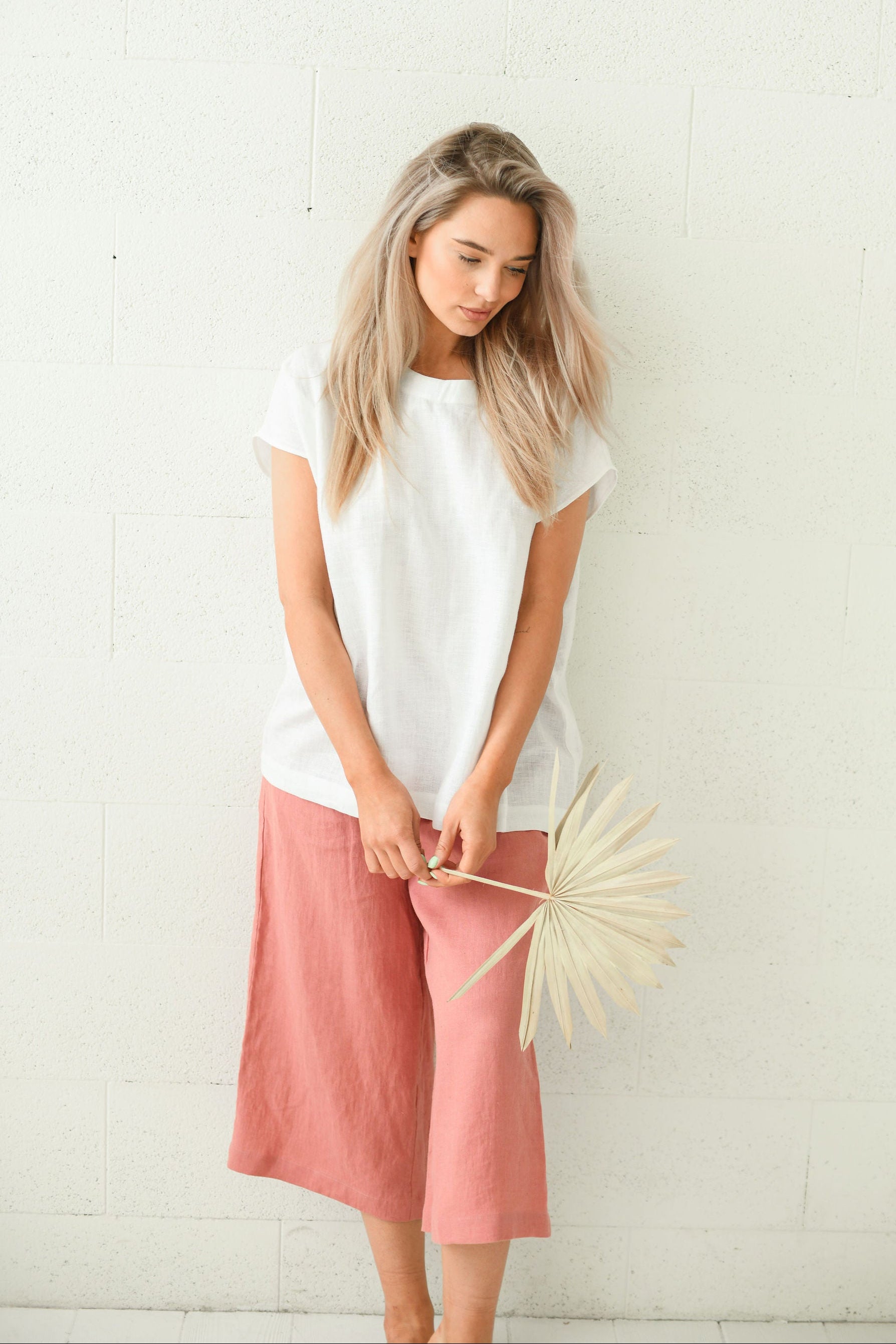 White linen top soft relaxed standing pose minimalist studio, handmade linen top slow fashion