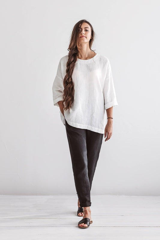 Black linen pants standing pose studio view showing relaxed fit, handmade linen pants slow fashion