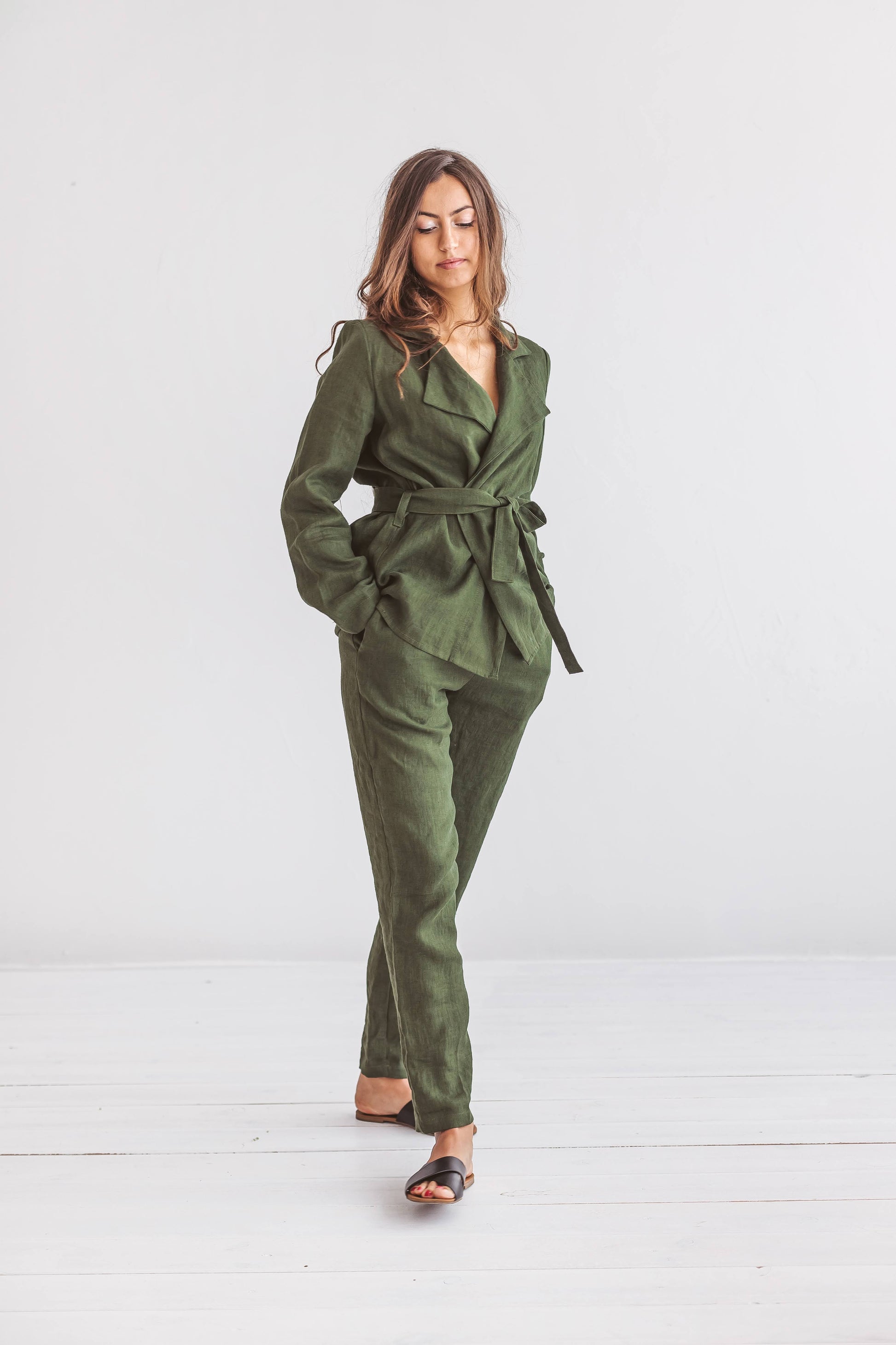 Forest green linen pants front view in soft natural studio light, handmade linen pants slow fashion