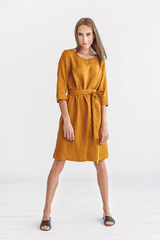Mustard linen dress relaxed natural stance showing minimalist design, handmade linen dress slow fashion