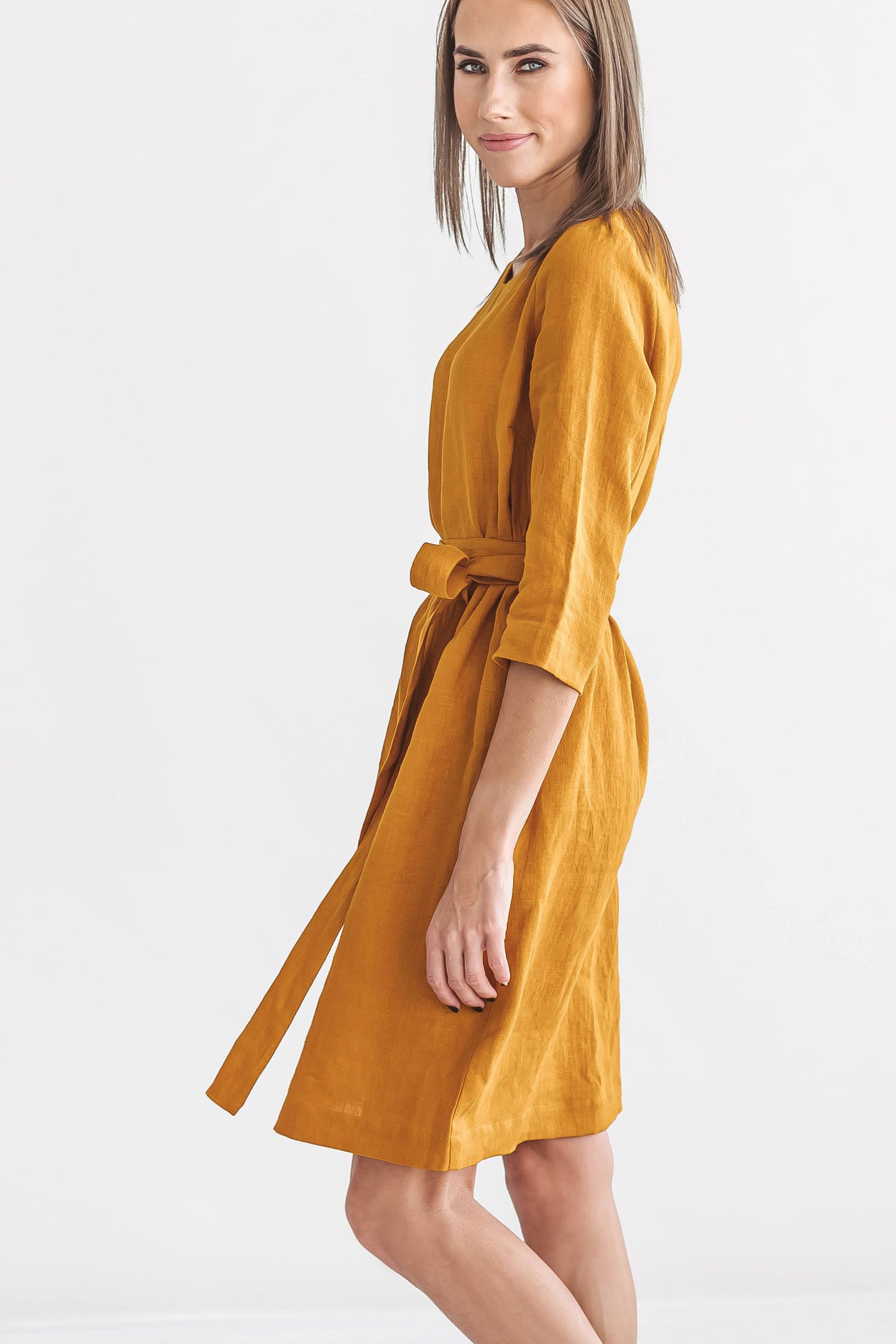 Mustard linen dress side view showing relaxed silhouette, handmade linen dress slow fashion
