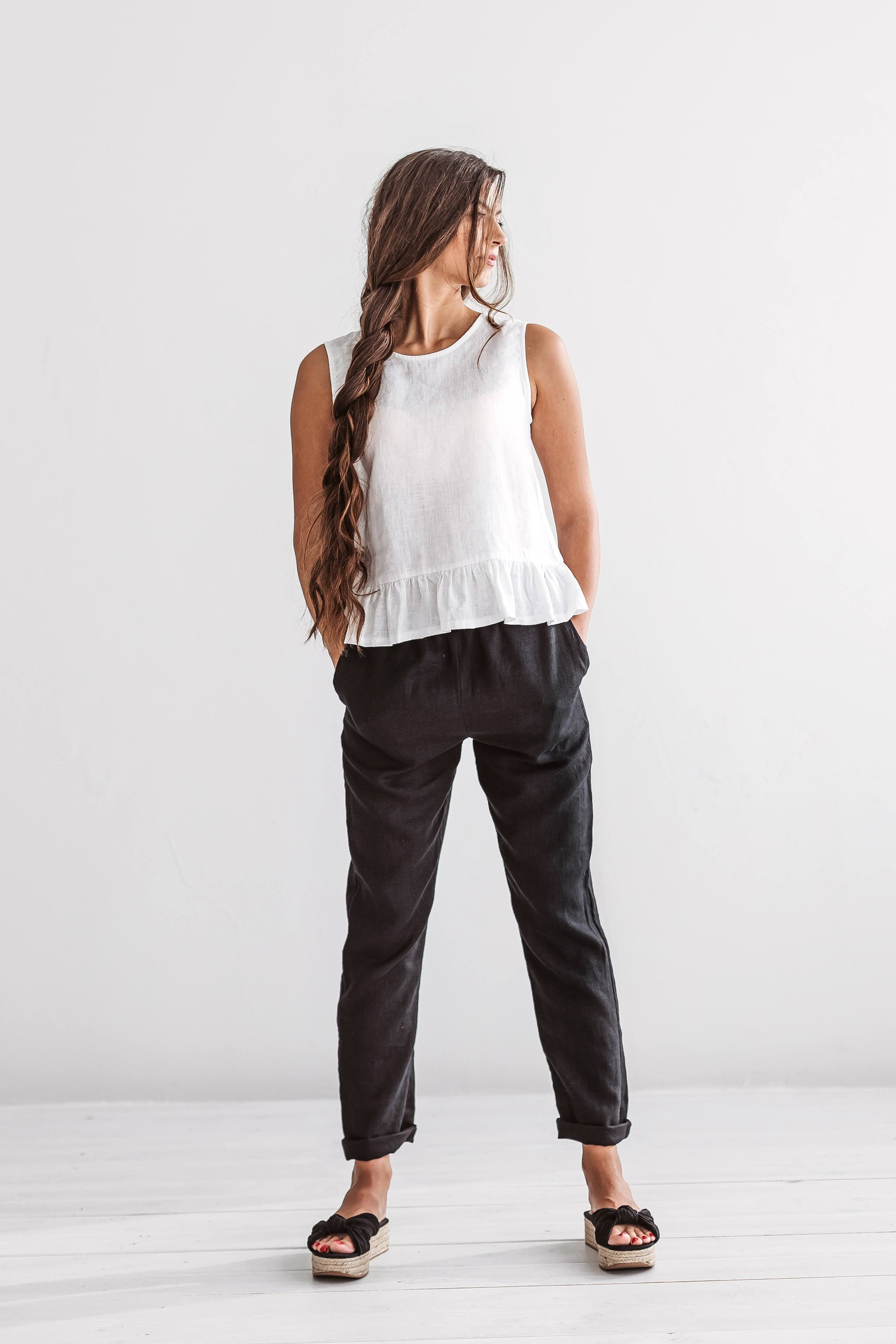 White linen top standing pose with minimalist silhouette, handmade linen top slow fashion