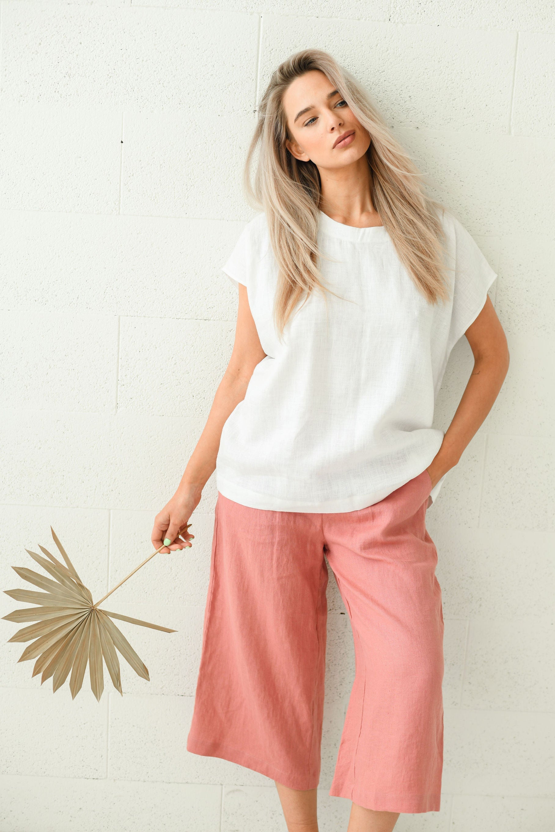 Salmon linen pants clean profile view showing wide-leg cut, handmade linen pants slow fashion