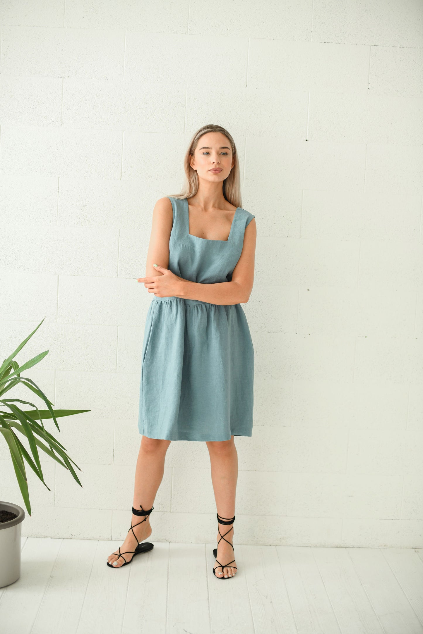 Dusty turquoise linen dress side view showing relaxed midi silhouette, handmade linen dress slow fashion