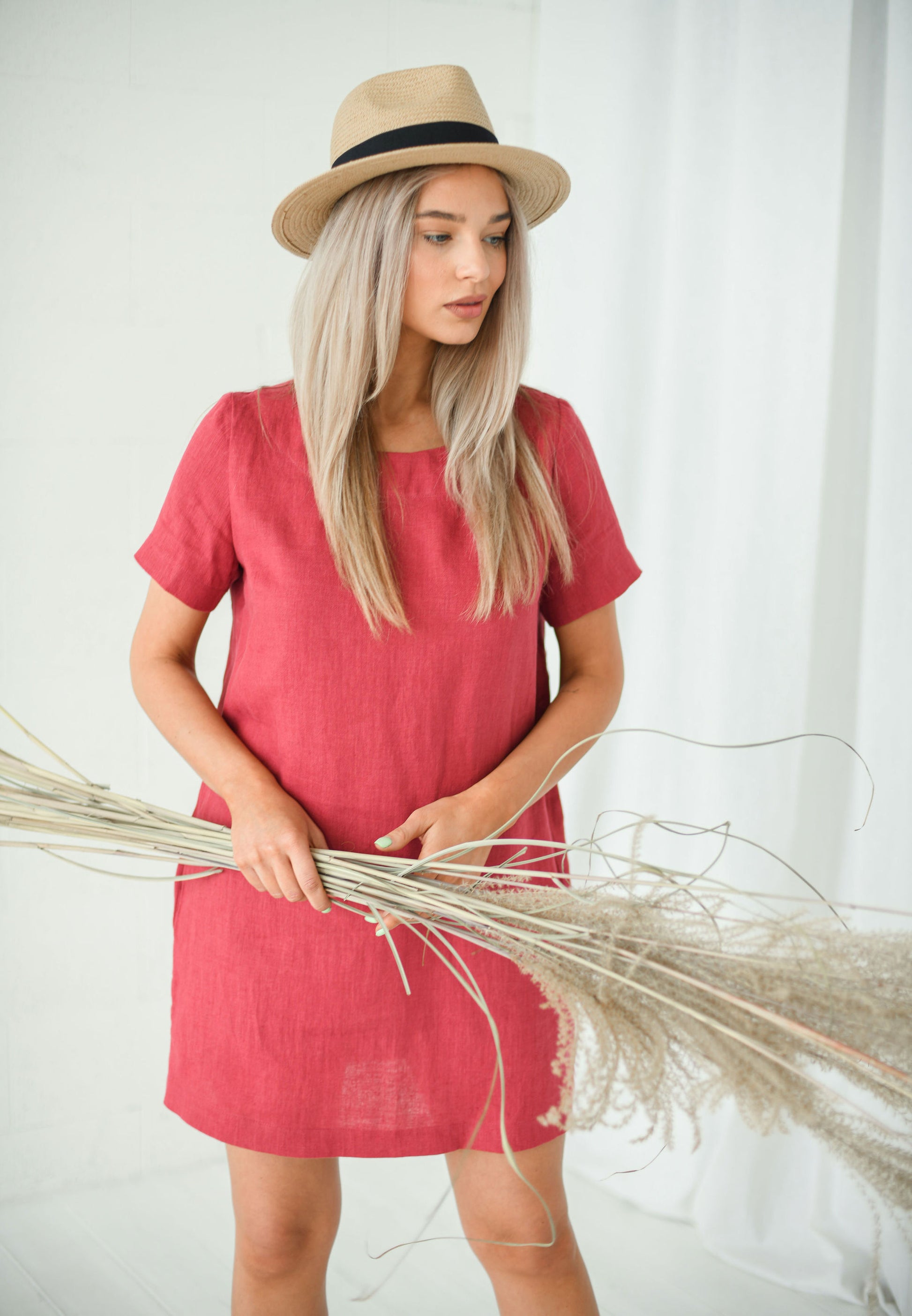 Dusty raspberry linen dress front view showing minimalist a-line design, handmade linen dress slow fashion