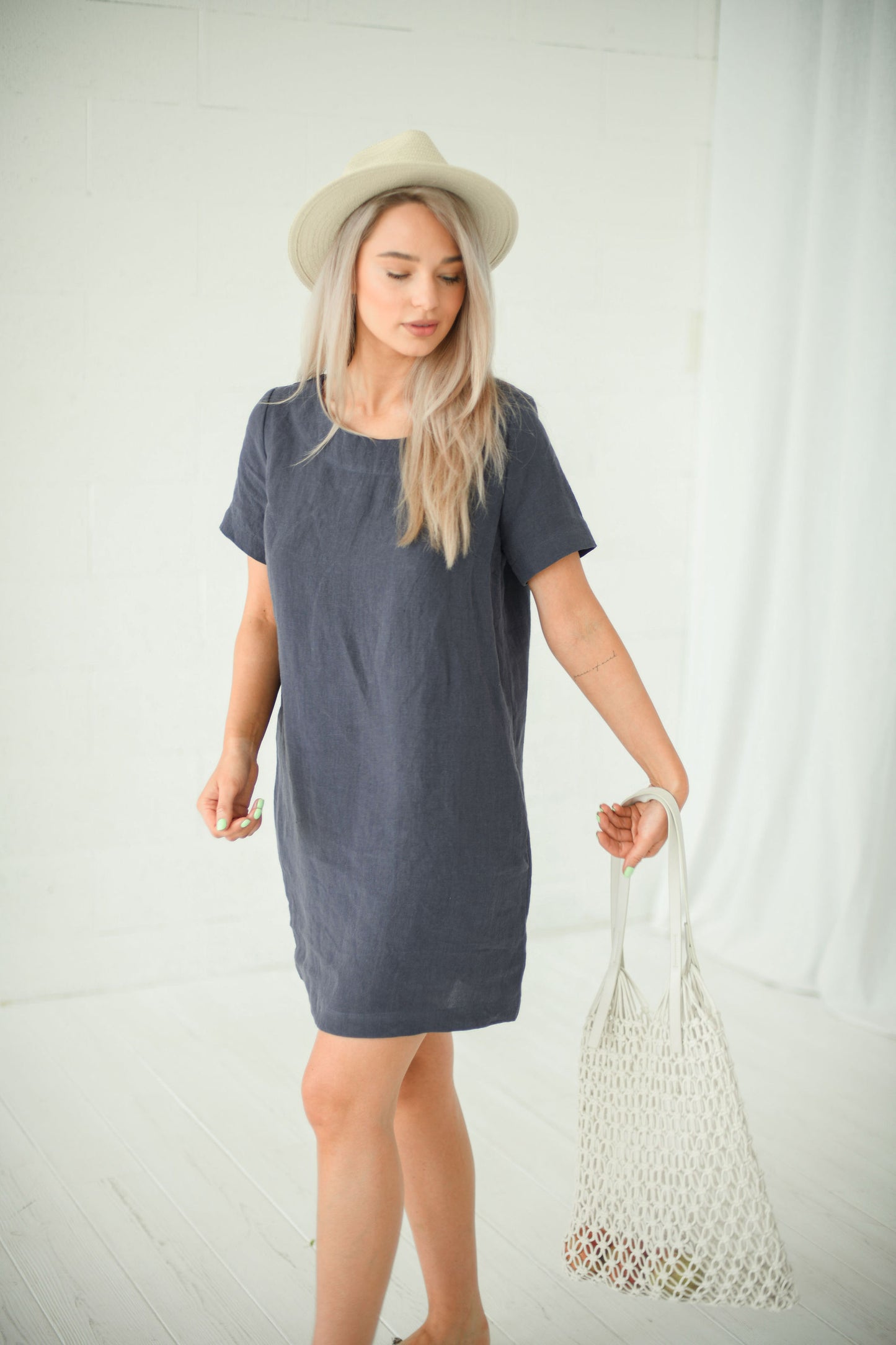 Graphite grey linen dress standing studio pose showing relaxed mini length, handmade linen dress slow fashion