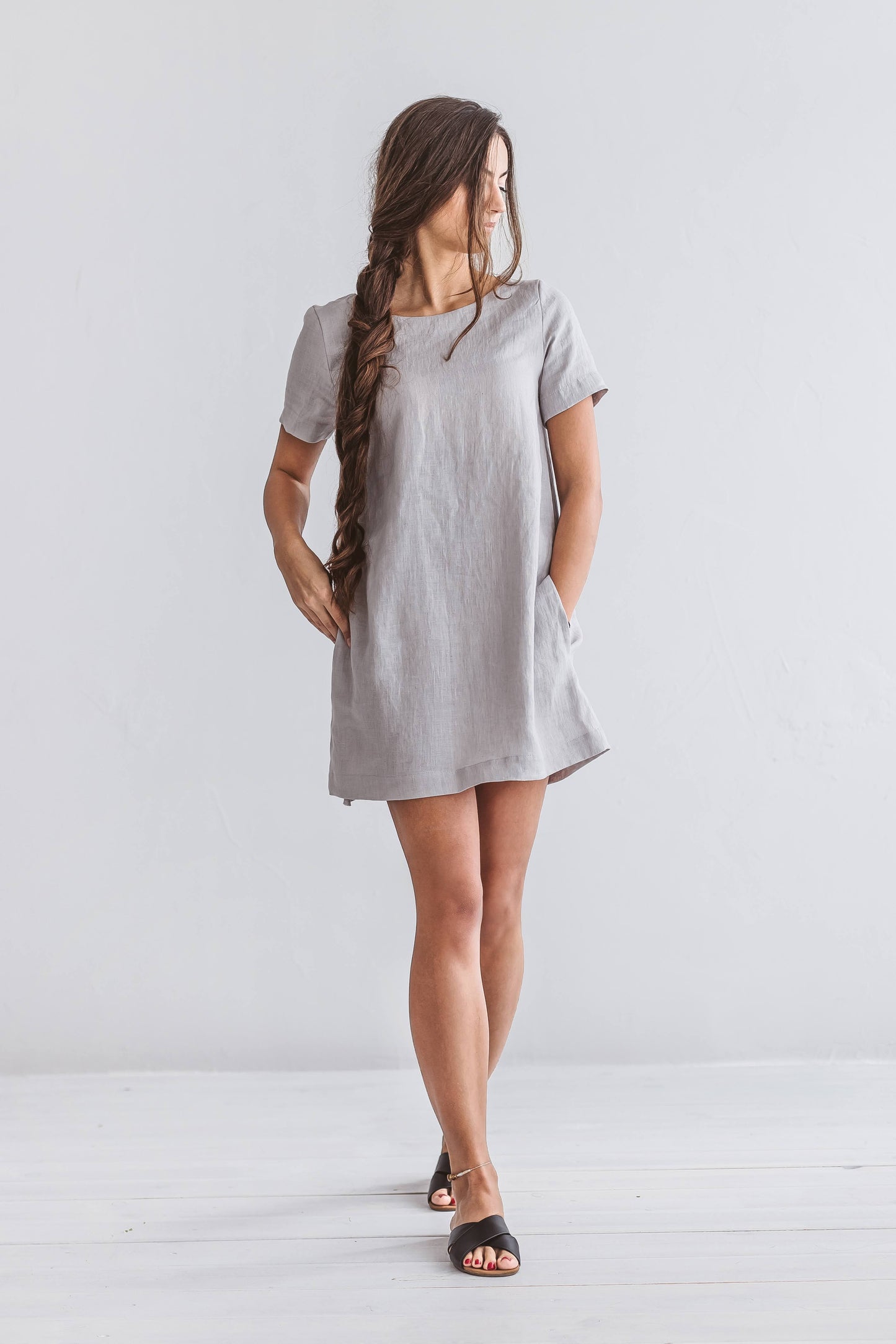 Grey linen dress studio portrait showing relaxed fit and short sleeves, handmade linen dress slow fashion