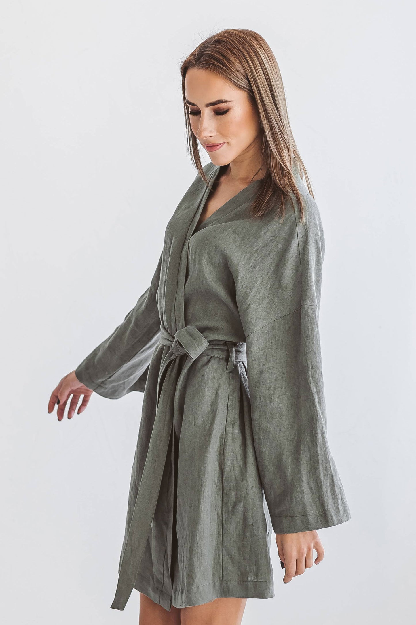 Khaki linen robe smiling pose showing comfortable fit and soft drape, handmade linen robe slow fashion
